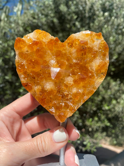 BellaVee citrine heart crystal held in hand showing natural amber cluster formation abundance stone Austin Texas