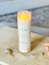 Lit Clarity Ritual Candle by BellaVee radiating soft, calming light in a serene home environment