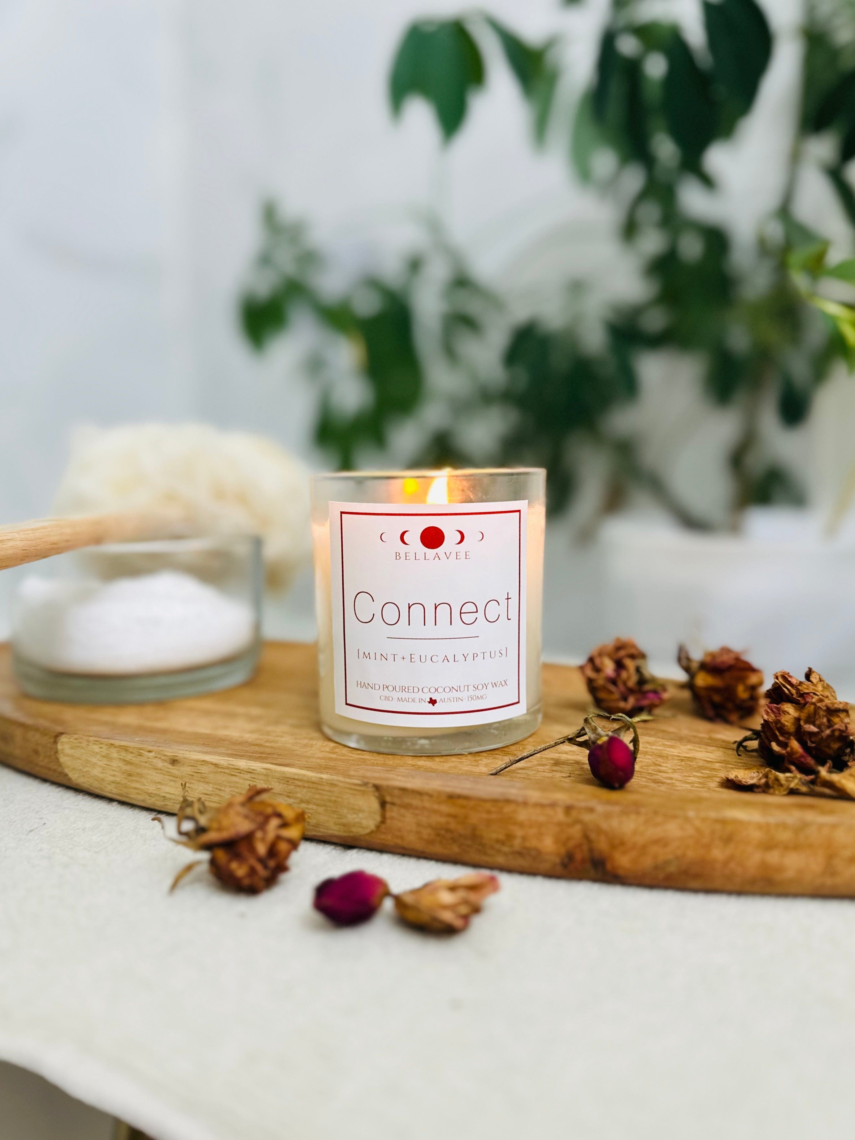 Lit Connect CBD candle, releasing the soothing scents of peppermint and eucalyptus, promoting relaxation and well-being