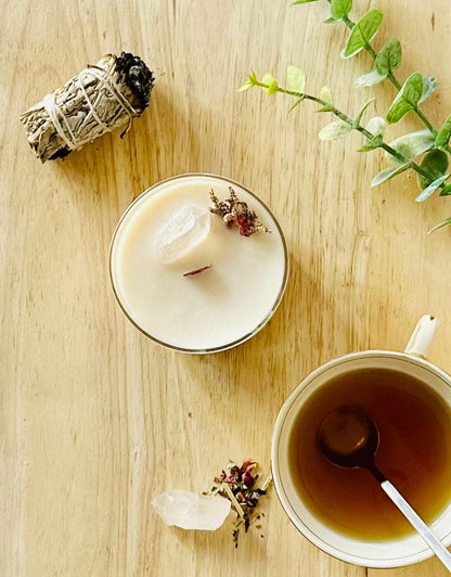 Top-down view of the Connect CBD Candle with wooden wick, topped with dried botanicals and a clear quartz crystal, showcasing handcrafted details and texture.
