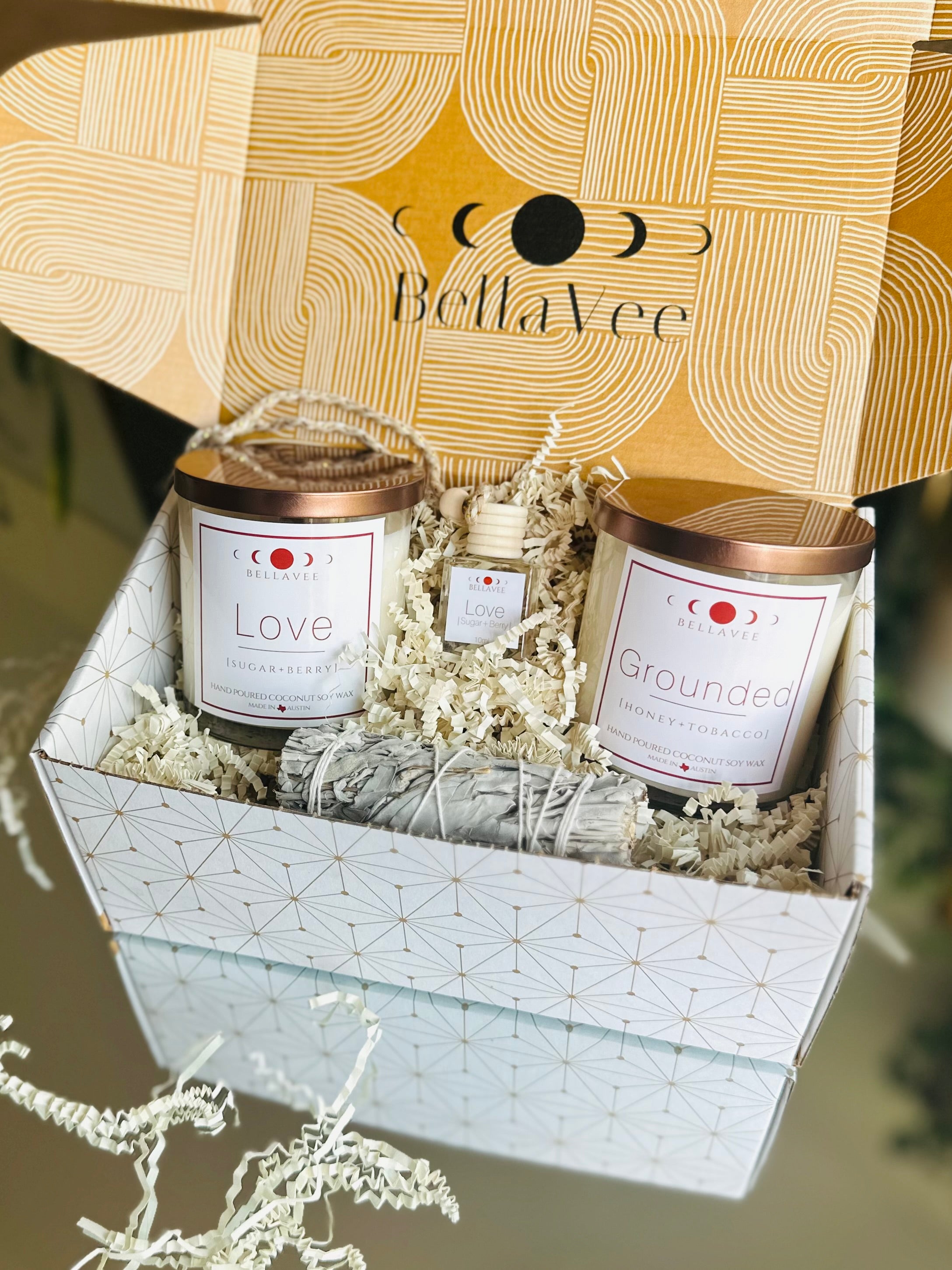 Thoughtfully curated New Beginnings Gift Box with crystal candles, car diffuser, and sage bundle, perfect for creating a welcoming new home