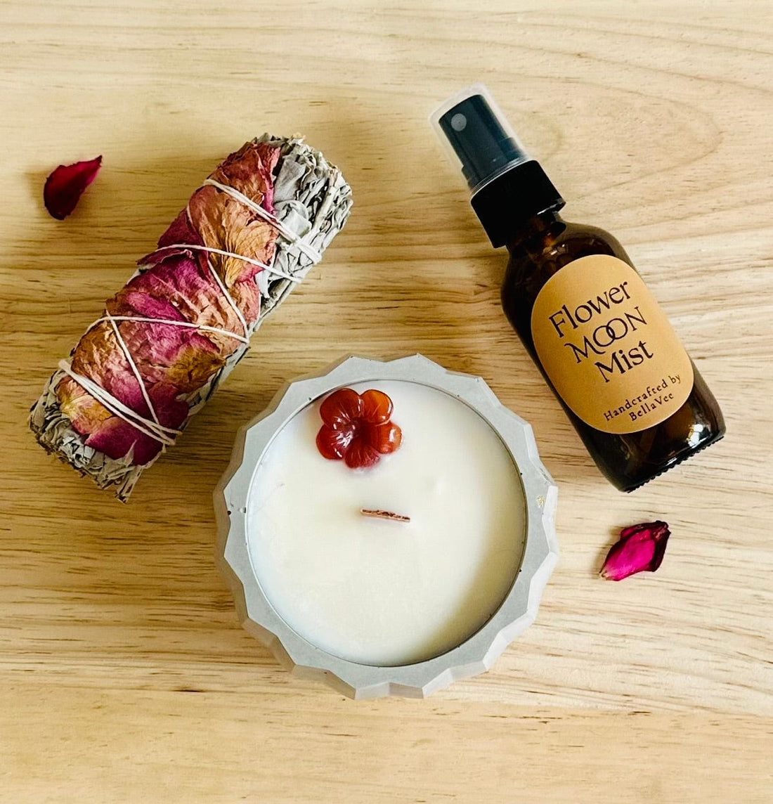 Close-up of mist bottle and mini candle on soft linen background