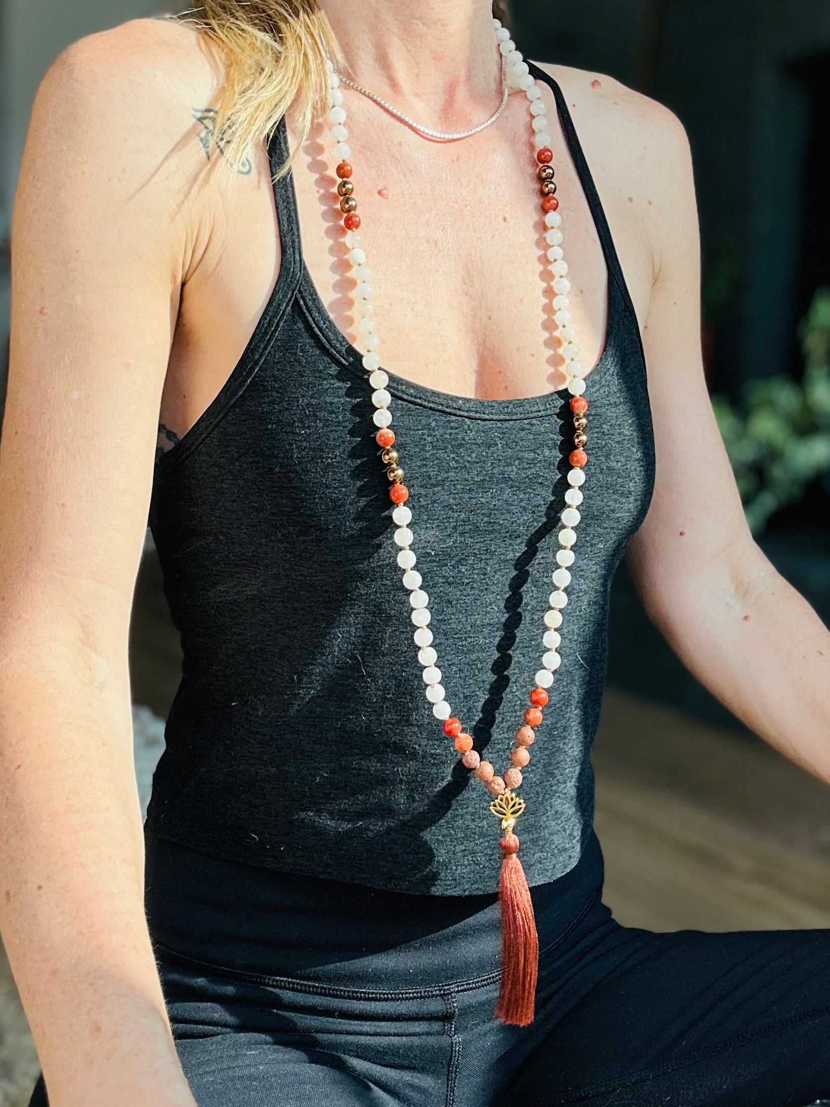 elemental balance crystal mala worn as a reminder of strength, balance, and spiritual growth, crafted with white jade, jasper, and hematite