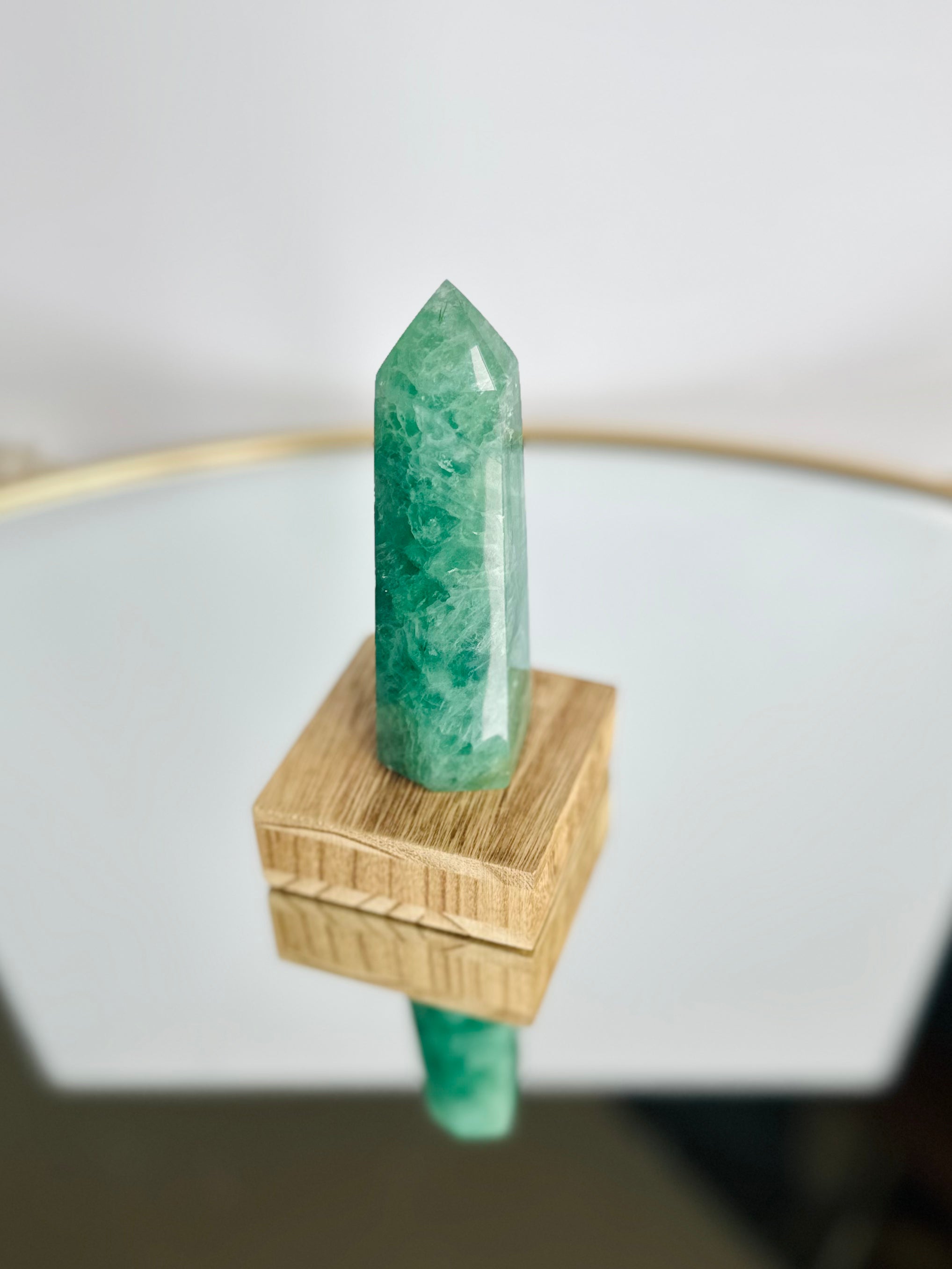 Green Fluorite tower, admired for its vibrant green tones and healing vibrations, perfect for organizing thoughts and bringing stability