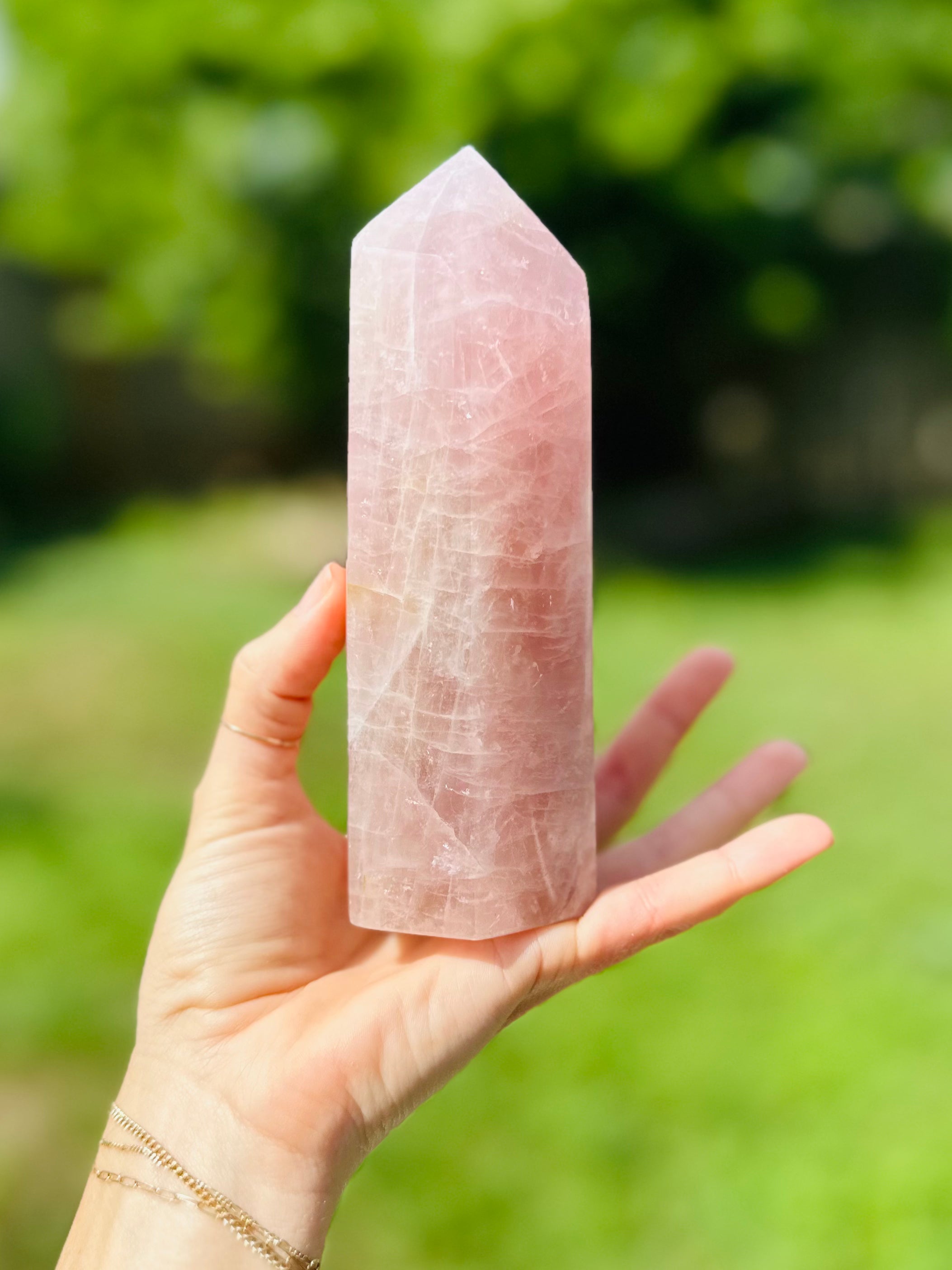 The sleek, pointed form of the Rose Quartz Crystal Tower enhances positive energy flow, promoting self-love and inner peace