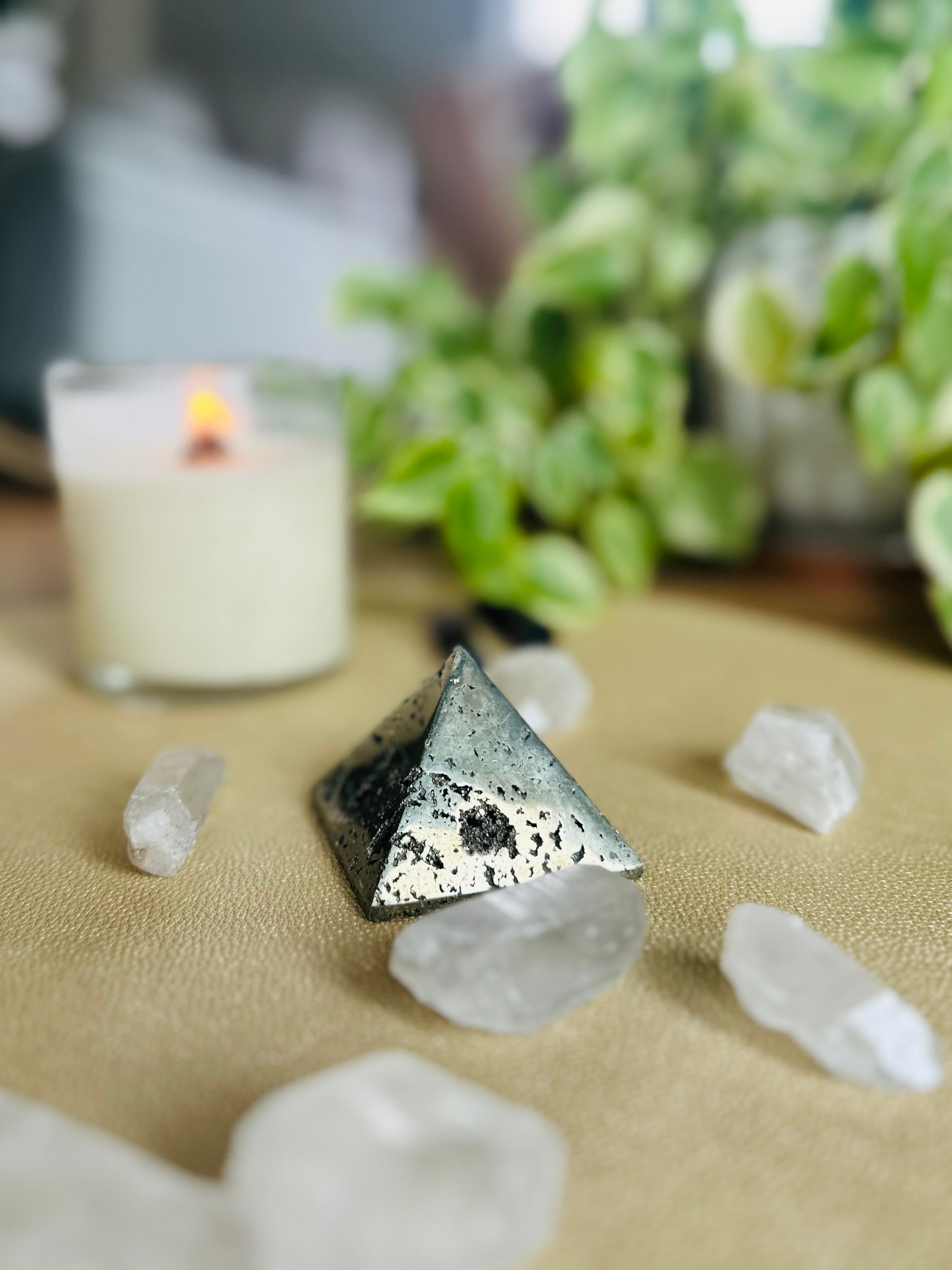 Pyrite Pyramid with crystals and candles, amplifies energy for wealth and protection, perfect for a positive and focused space