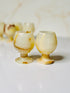 Mini wine glass-style Onyx shot glasses, perfect for special occasions, offering natural cooling properties and stunning stone patterns