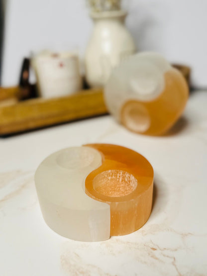 Yin &amp; Yang Selenite Candle Holder features pure white and orange selenite halves, symbolizing balance and dual energies in your space