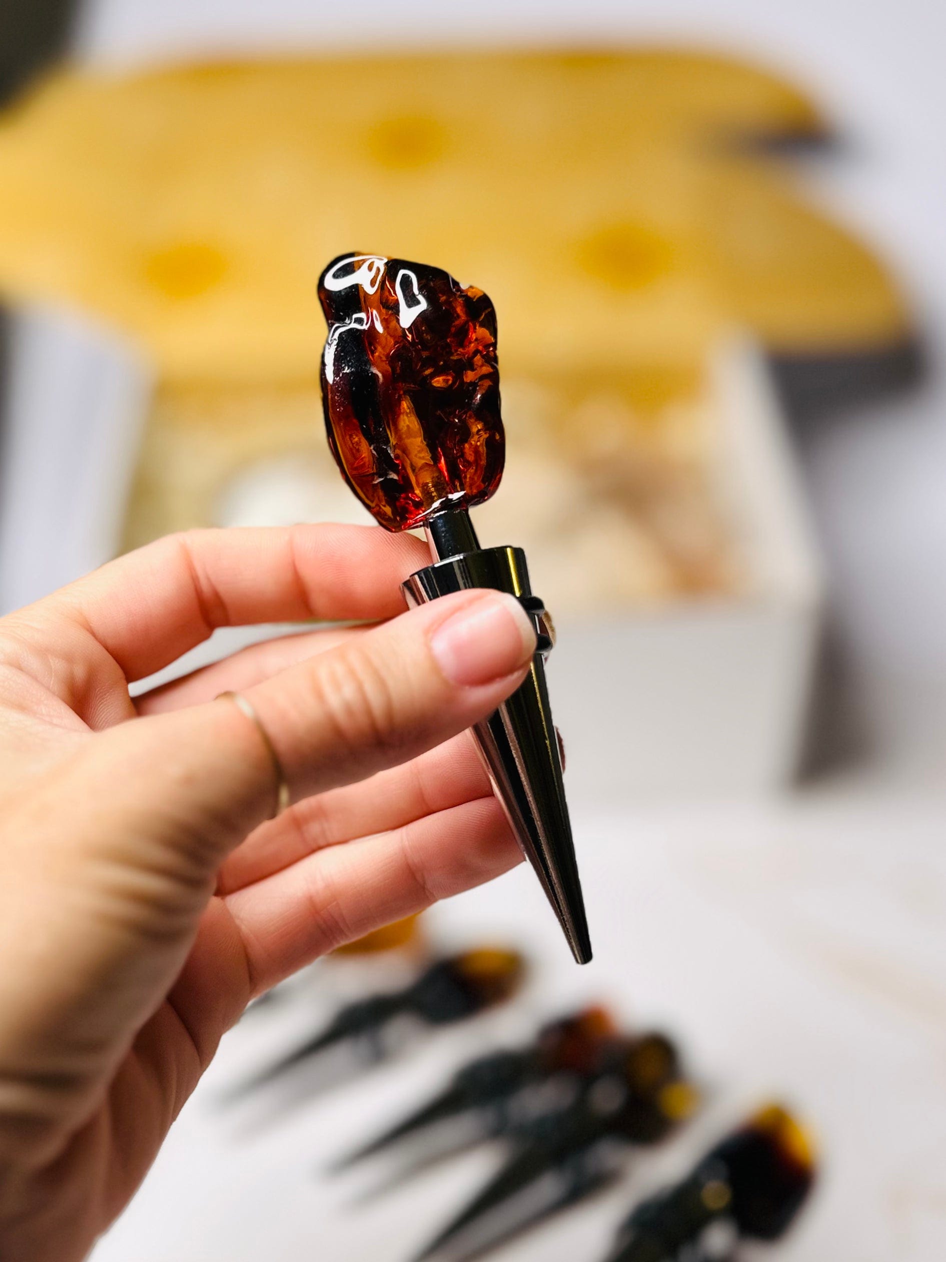 Amber-topped wine stopper, featuring Baltic amber, known for its grounding and healing properties.