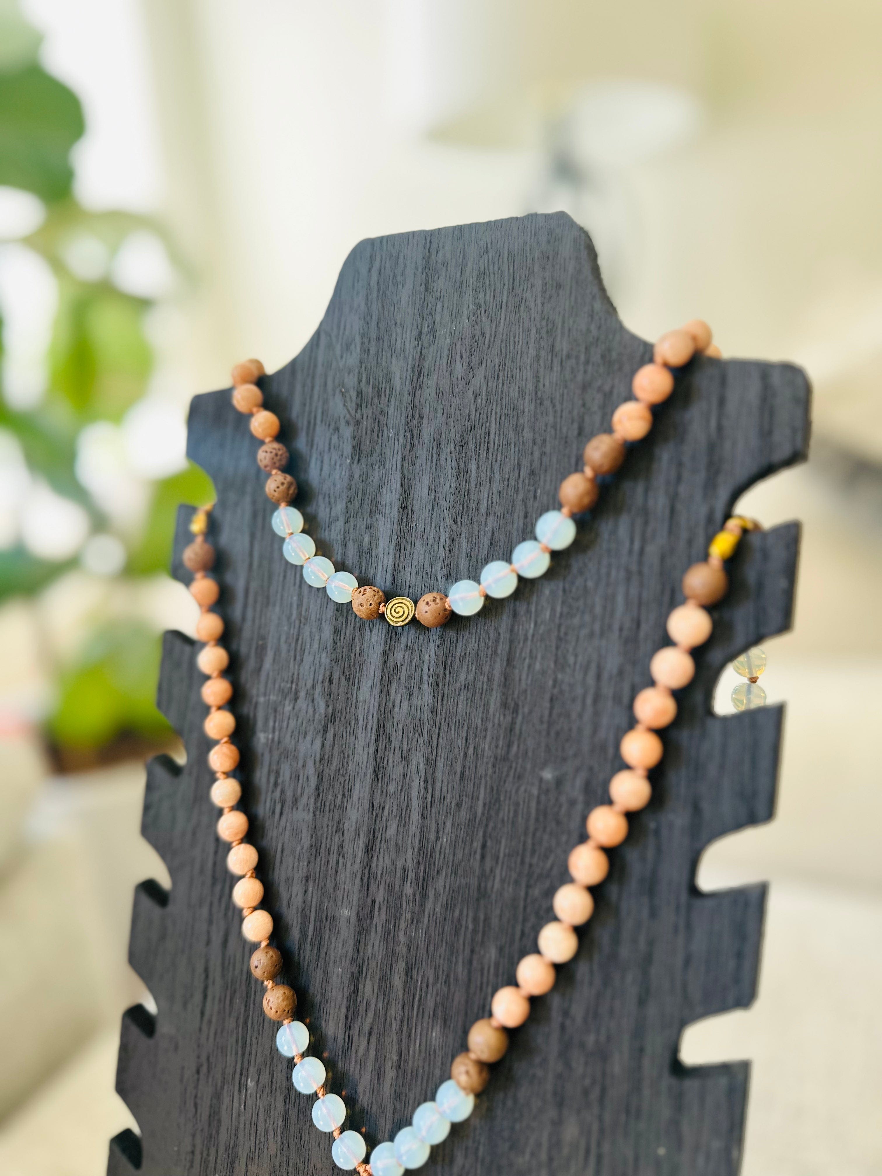 Opalite and Peach Moonstone Mala promotes spiritual transformation and grounding with Lava and Hematite stones