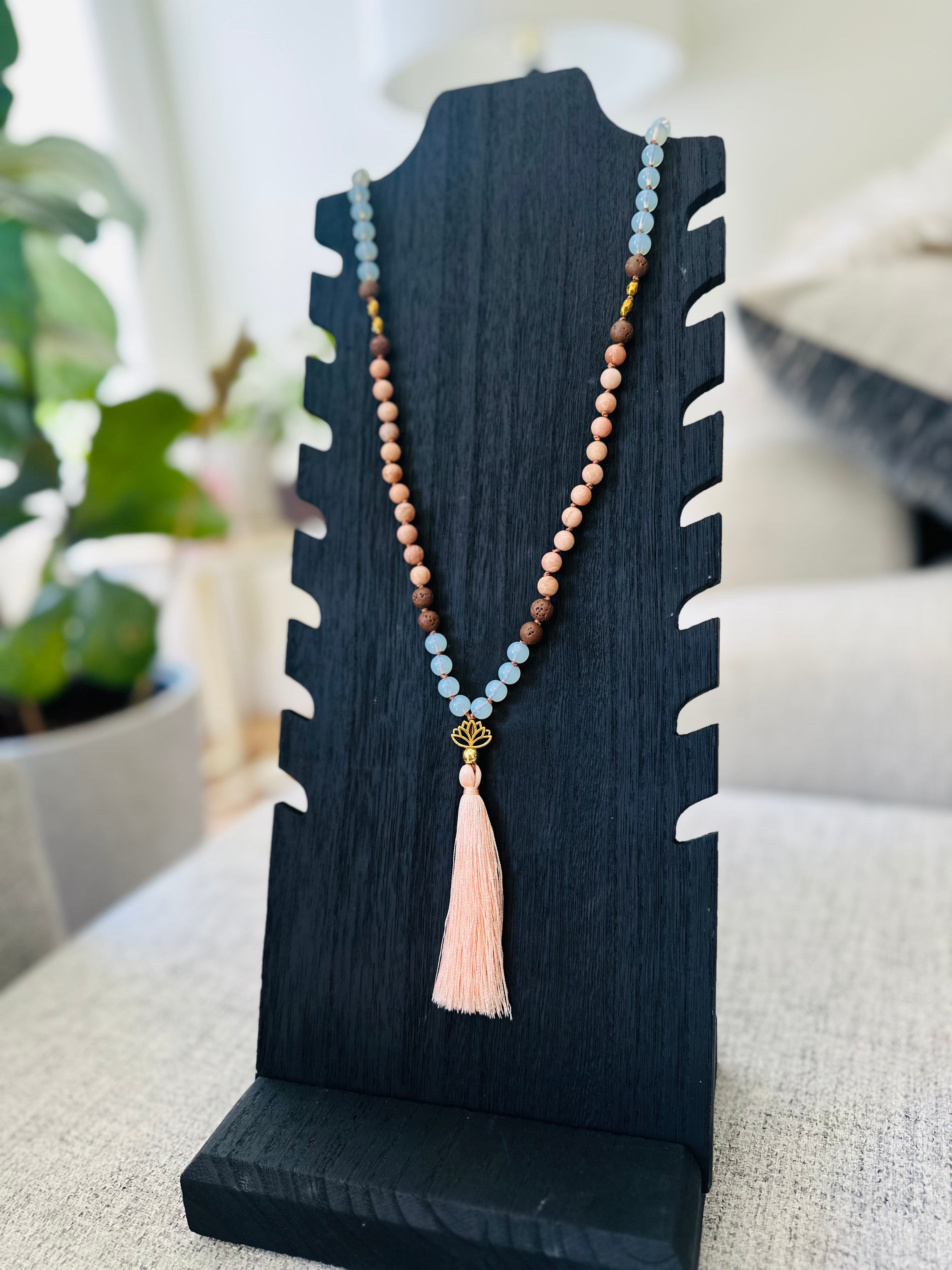 Inner Harmony Mala, featuring Lava, Opalite, Peach Moonstone, and Hematite, promotes grounding, emotional balance, and personal growth