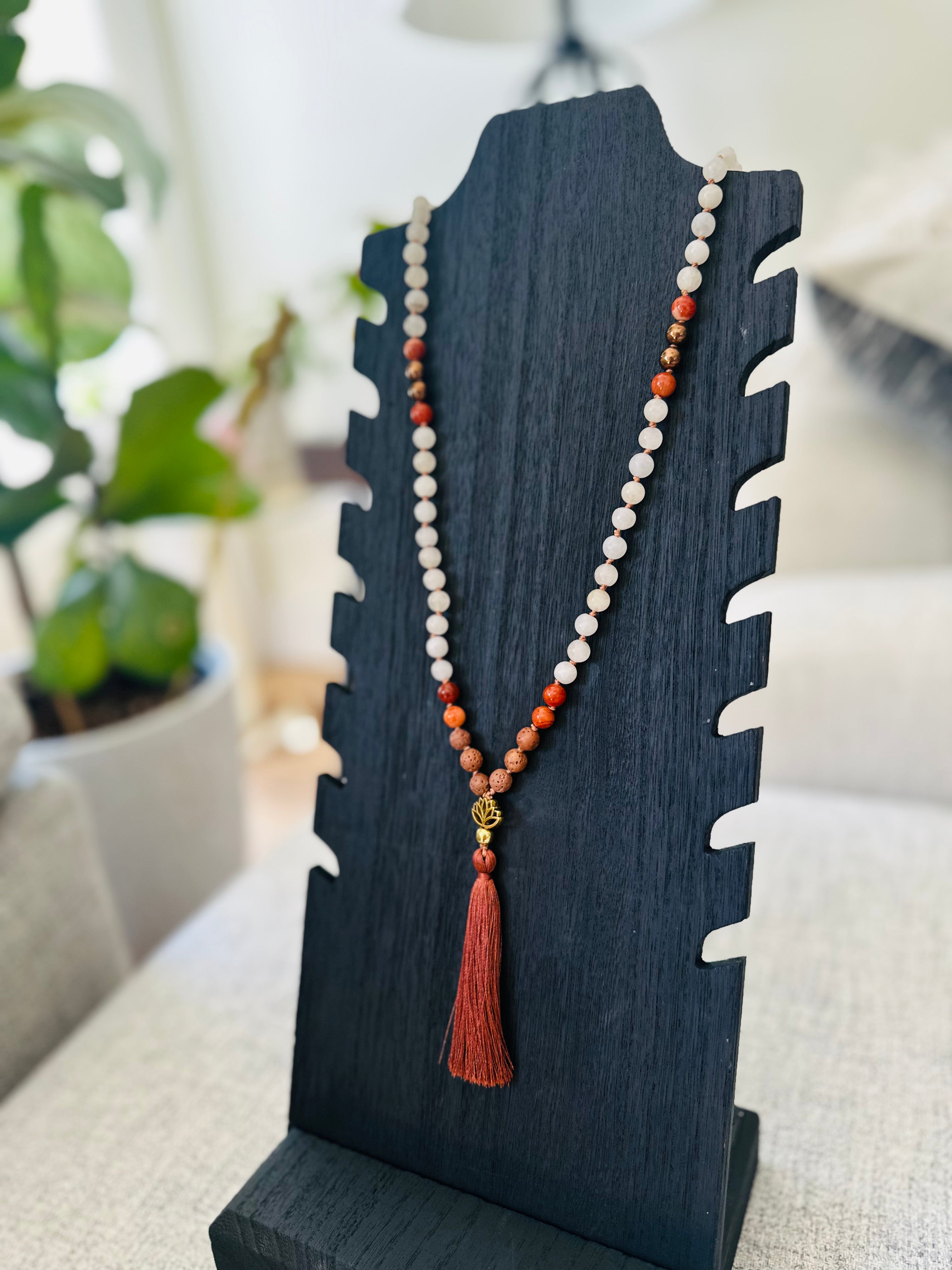 Courage & Clarity Mala: A grounding accessory with Red Jasper, White Jade, and Hematite, designed to enhance confidence and calm