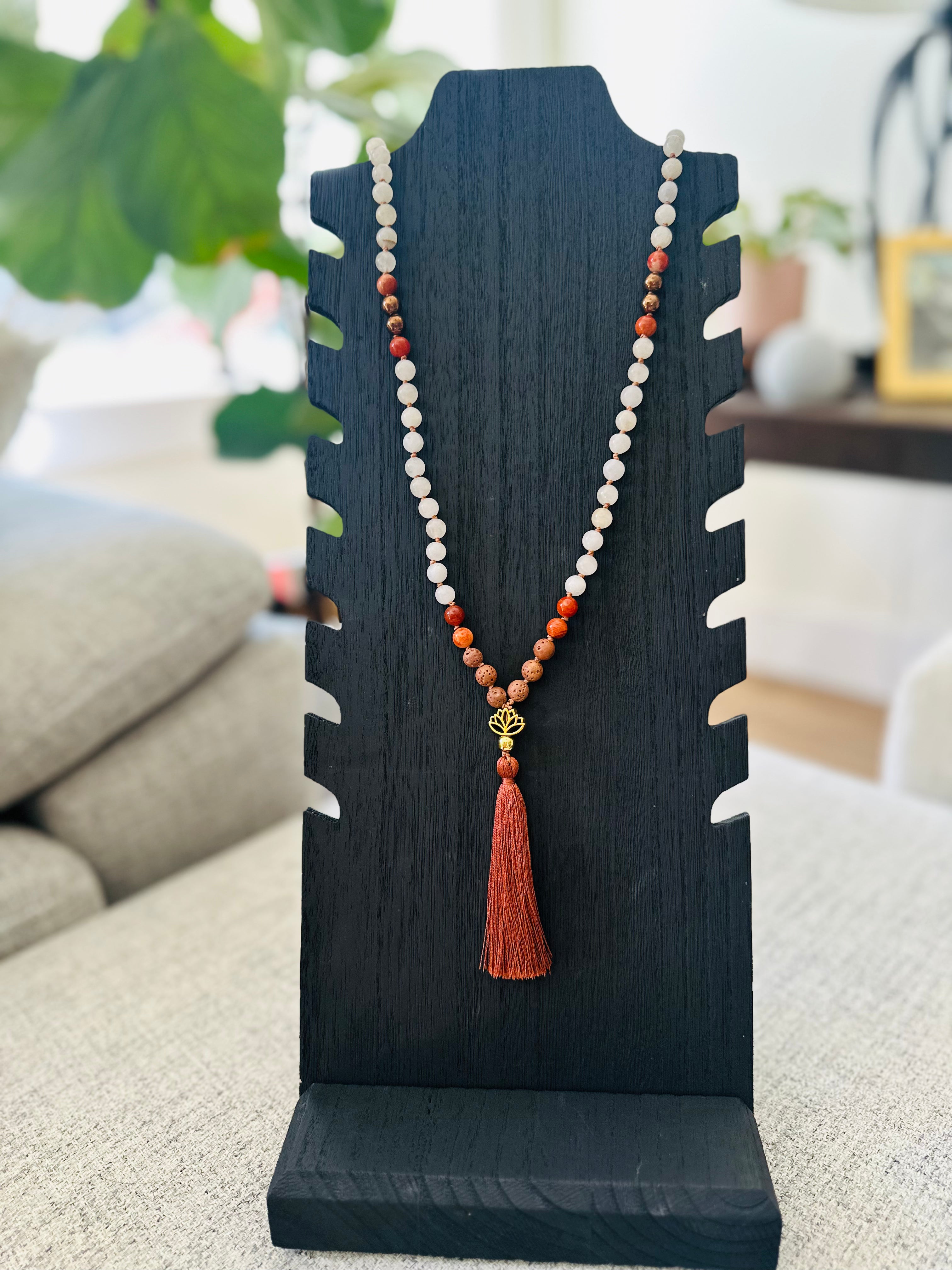 Courage & Clarity Mala: Red Jasper, White Jade, Hematite, and Lava combine to boost confidence and provide emotional clarity