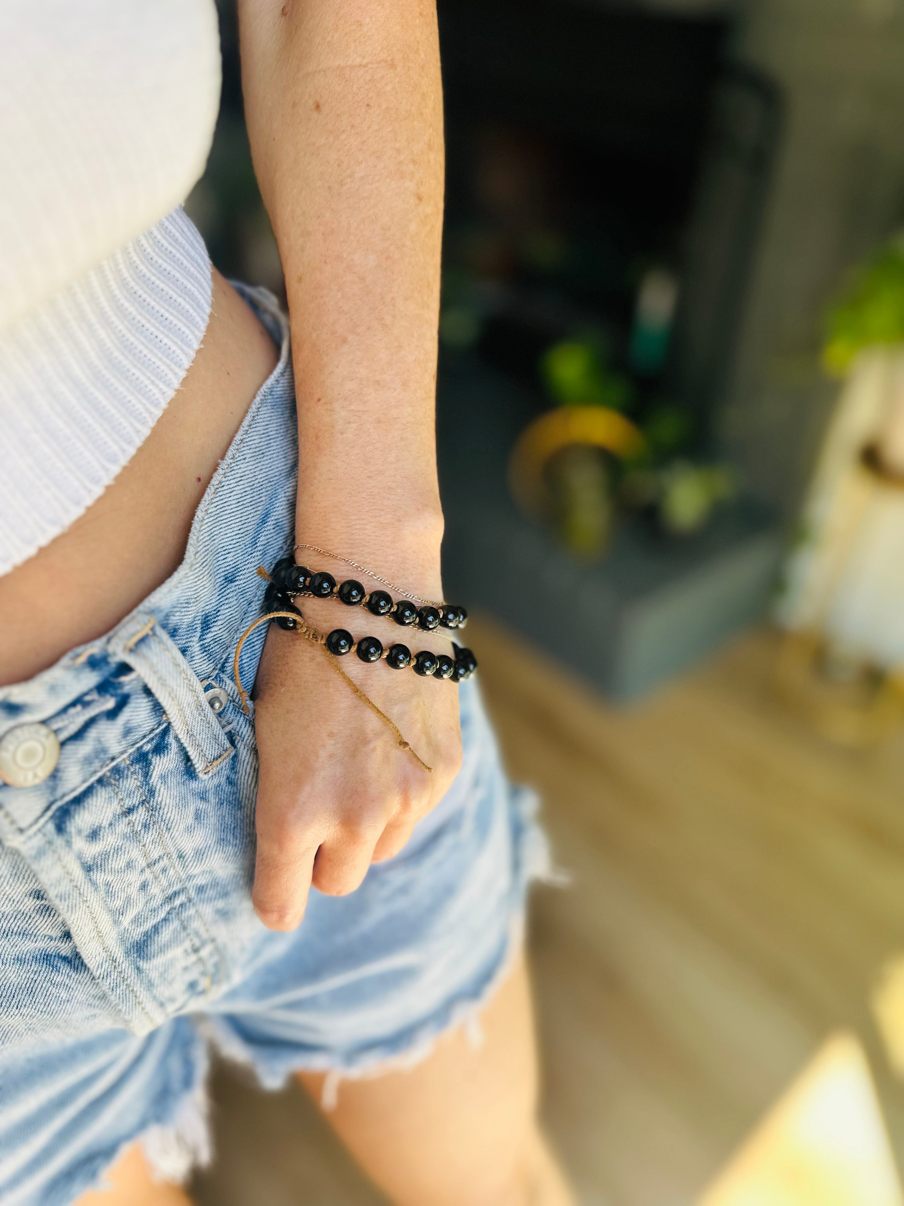 This knotted Obsidian bracelet serves as a grounding reminder, helping to absorb negative energy and provide emotional protection