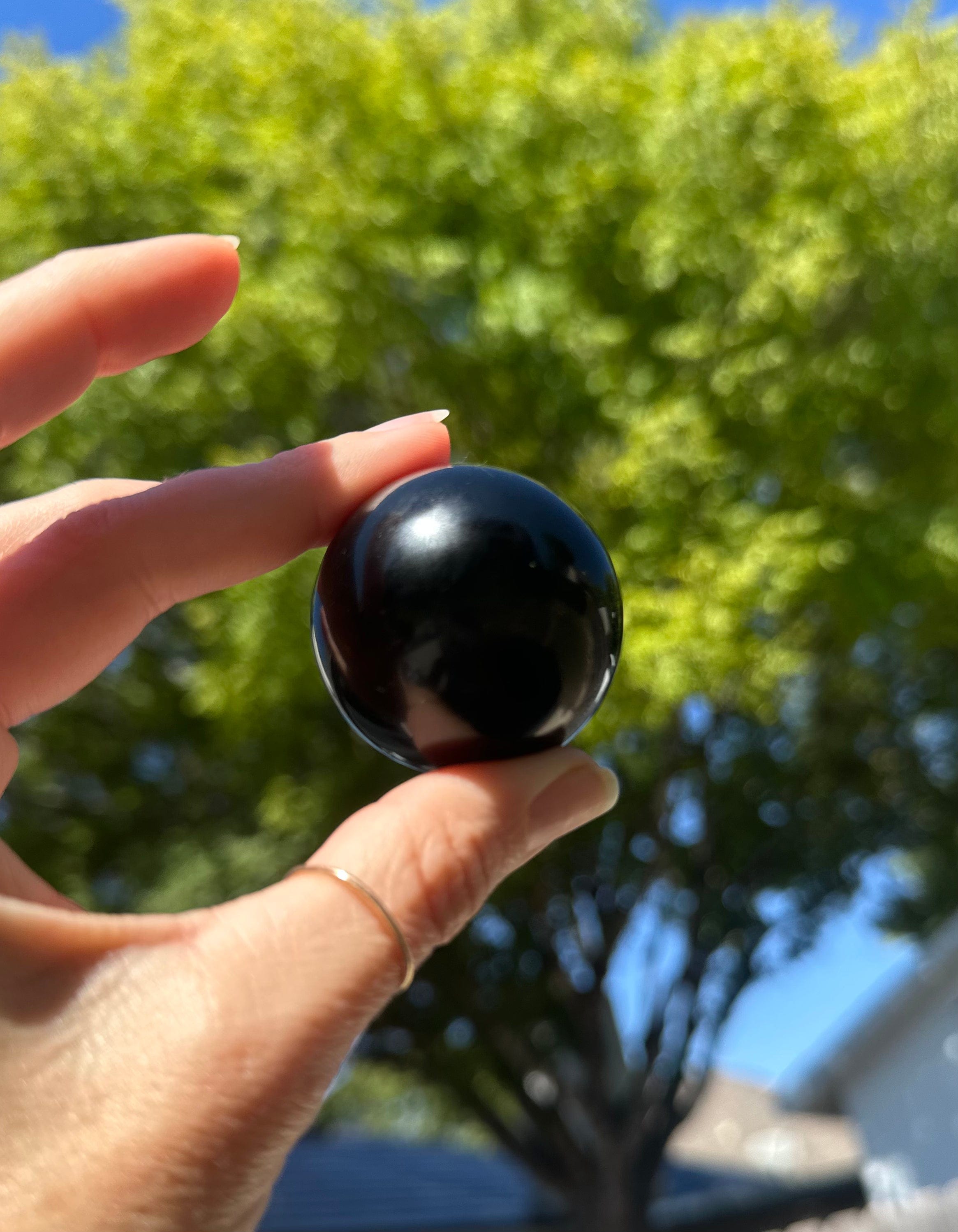 Onyx Sphere offers grounding energy, absorbs negativity, and enhances focus, making it perfect for meditation or adding elegance to any space