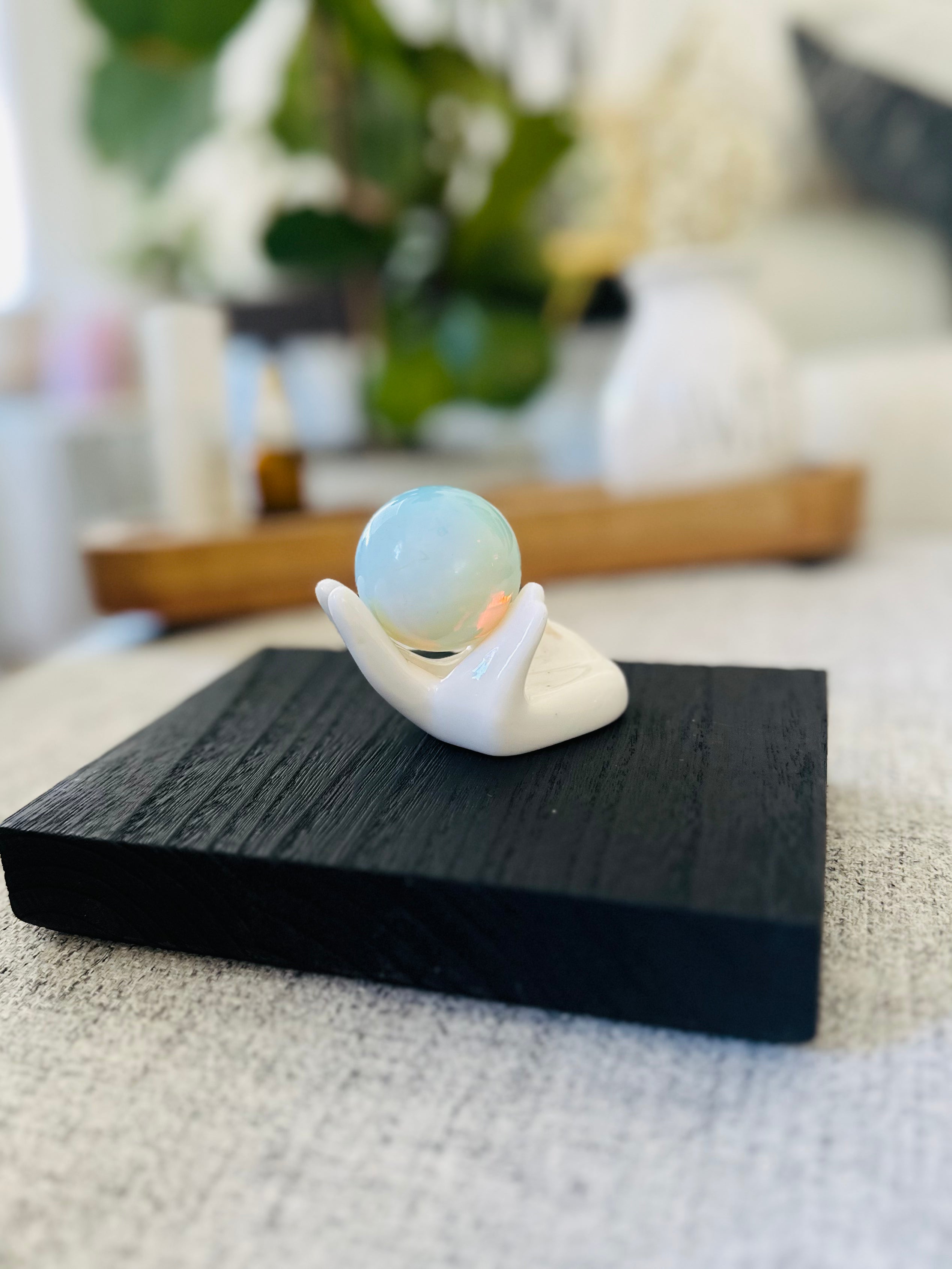 Embrace change with the Opalite Sphere, offering calming, uplifting energy that balances emotions and encourages inner peace