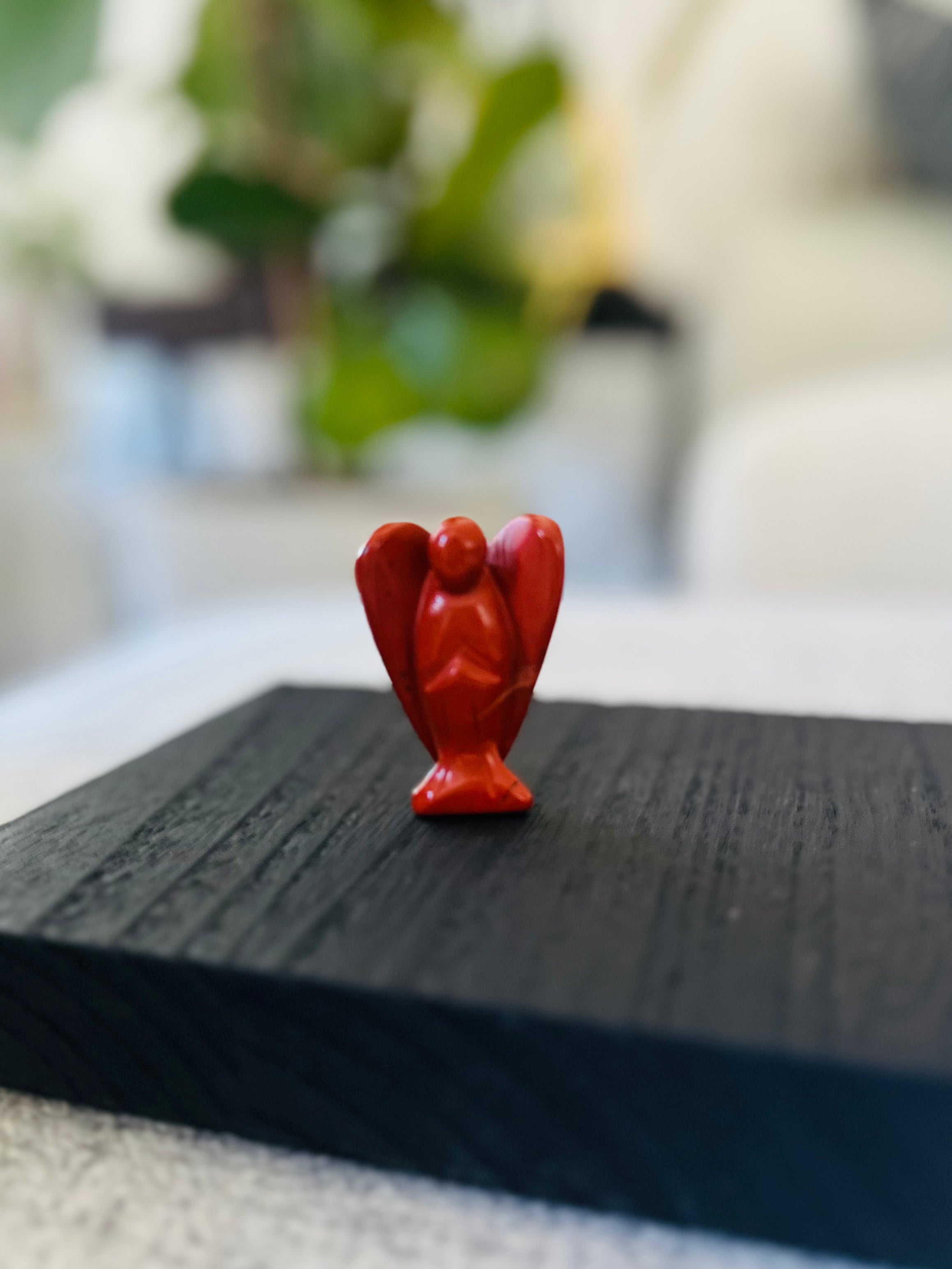 Red Jasper angel figurine from the Angel Crystal Collection, offering grounding and resilience in challenging times.