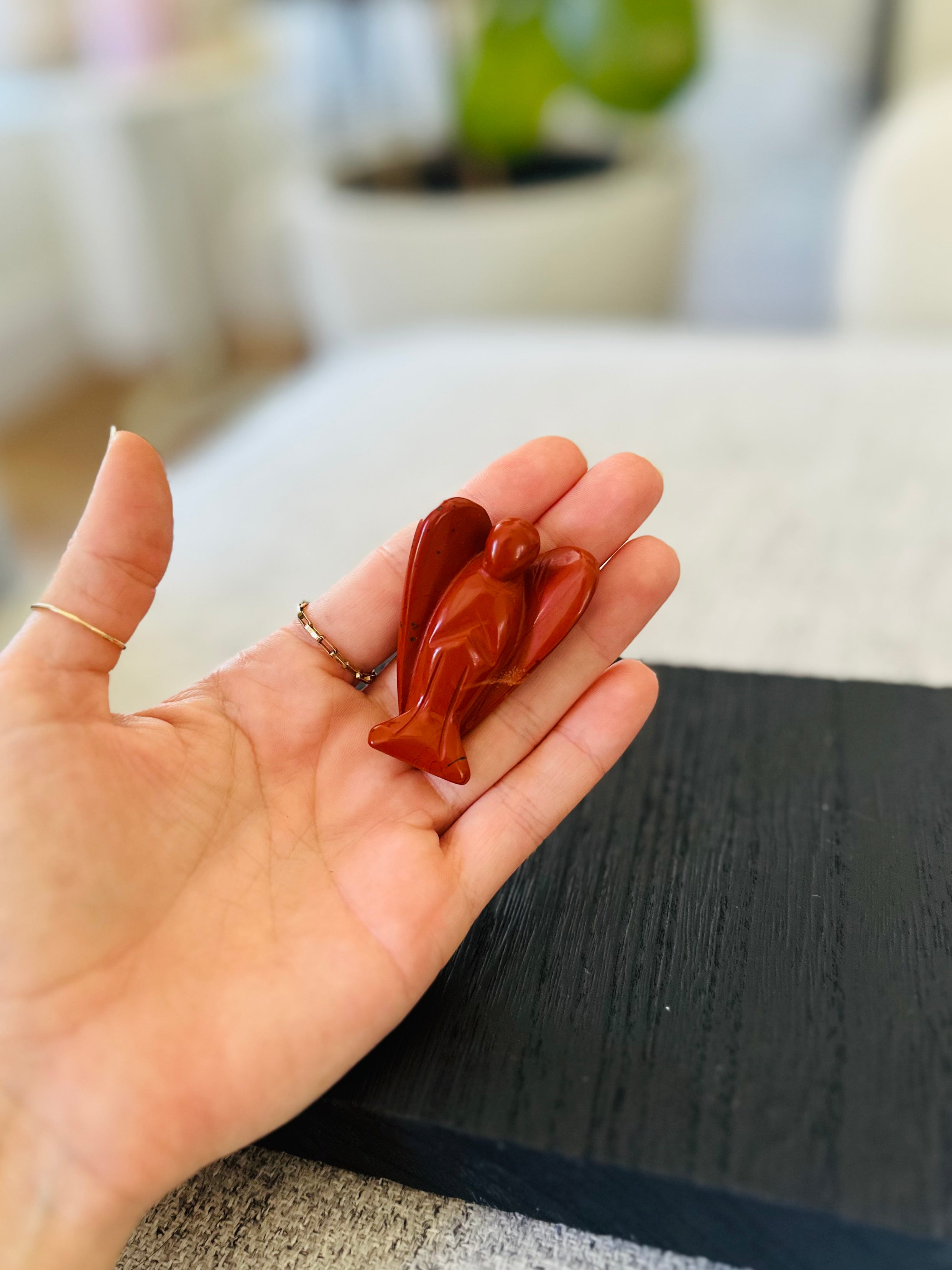 Red Jasper angel figurine, providing strength, endurance, and grounding energy for spiritual and emotional support.