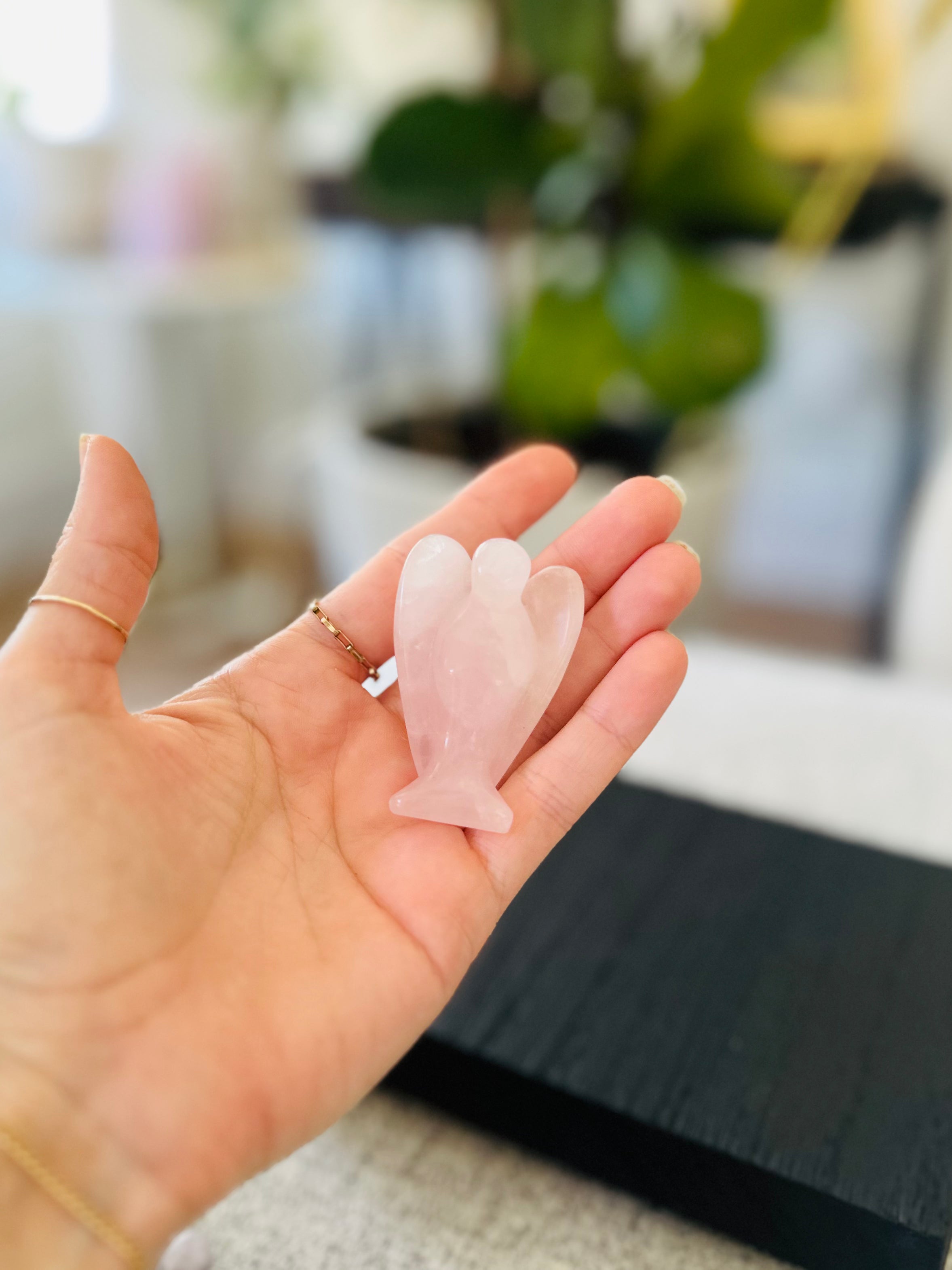 Angel figurine made from Rose Quartz, symbolizing unconditional love, compassion, and emotional healing.