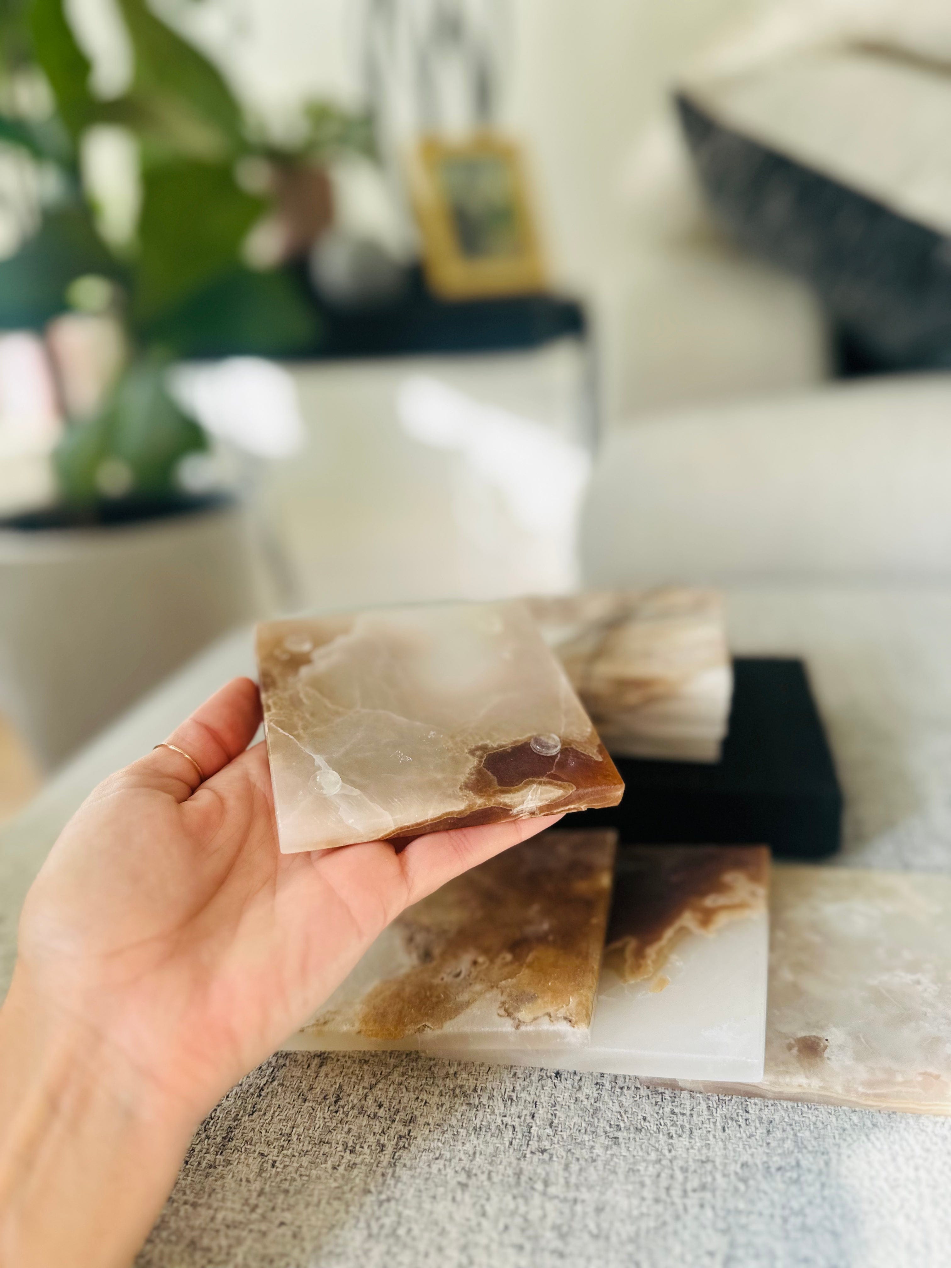 Onyx Coasters, a set of four one-of-a-kind pieces, offering both style and protection while adding sophistication to any room