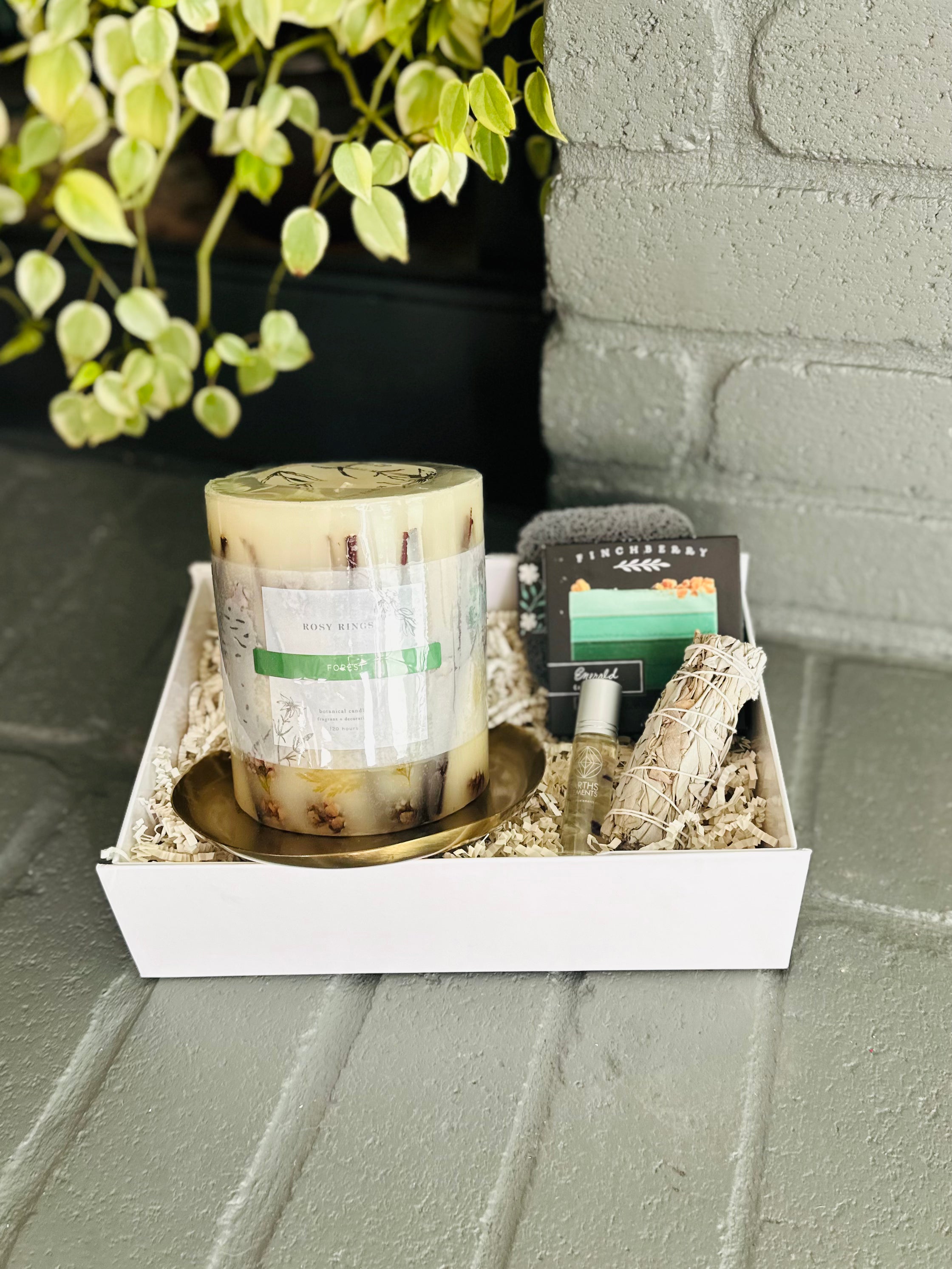 emerald forest gift box featuring sage bundle, fluorite roll-on, luxury soap, soap saver, and candle dish for a calming natural touch