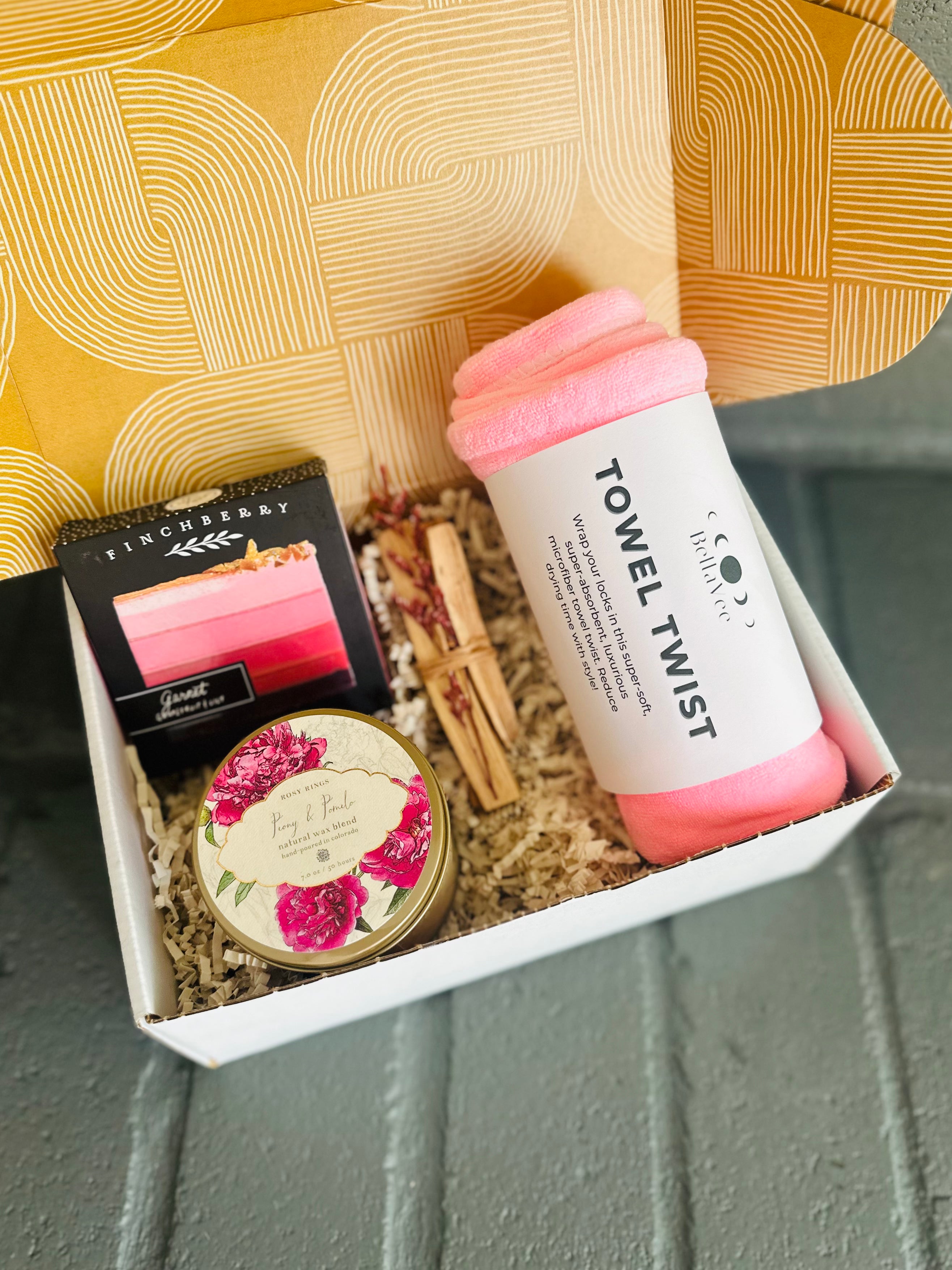 Pamper yourself with Pink Vibes Gift Box featuring a Trina Towel Twist, Garnet soap, Palo Santo, and Peony & Pomelo candle tin