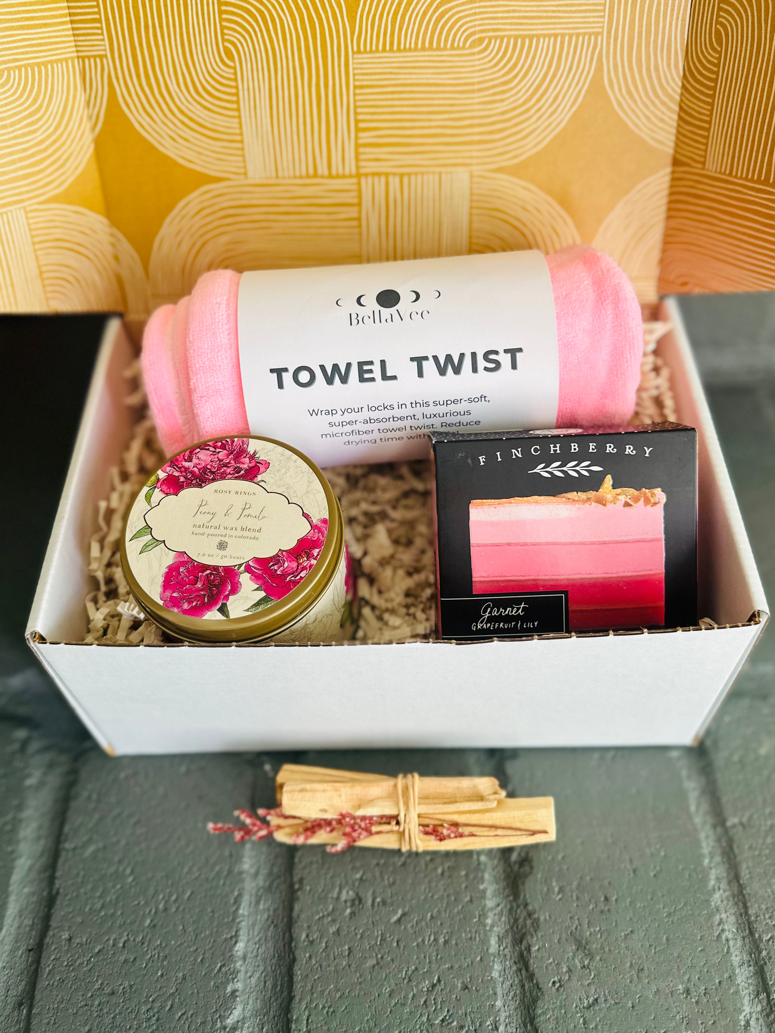 Pink Vibes Gift Box includes Trina Towel Twist, Garnet soap, Palo Santo, and Peony & Pomelo candle for vibrant self-care energy