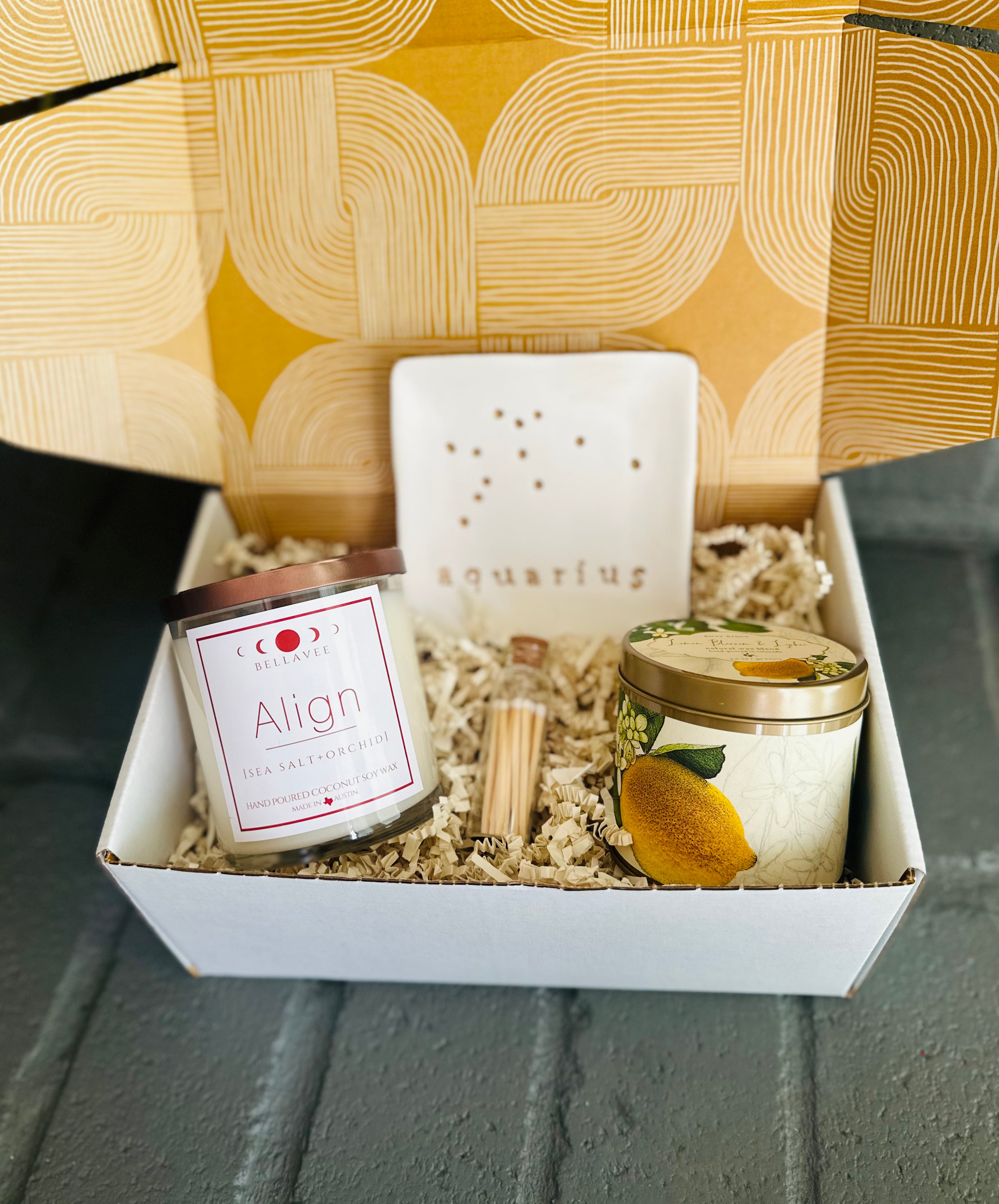 Cosmic Serenity Gift Box: Align Crystal Candle, Lemon Blossom Tin, matches, and zodiac dish to promote balance and relaxation