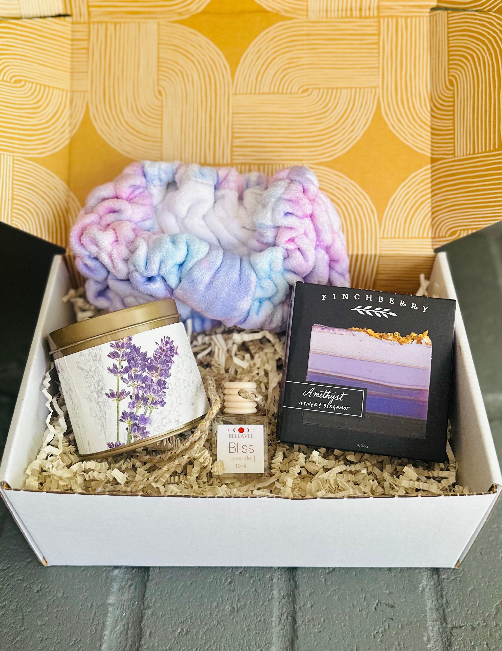 Lavender Bliss Gift Box with Bliss Car Diffuser, Amethyst vegan soap, Roman Lavender candle, and purple tie-dye spa headband for tranquility