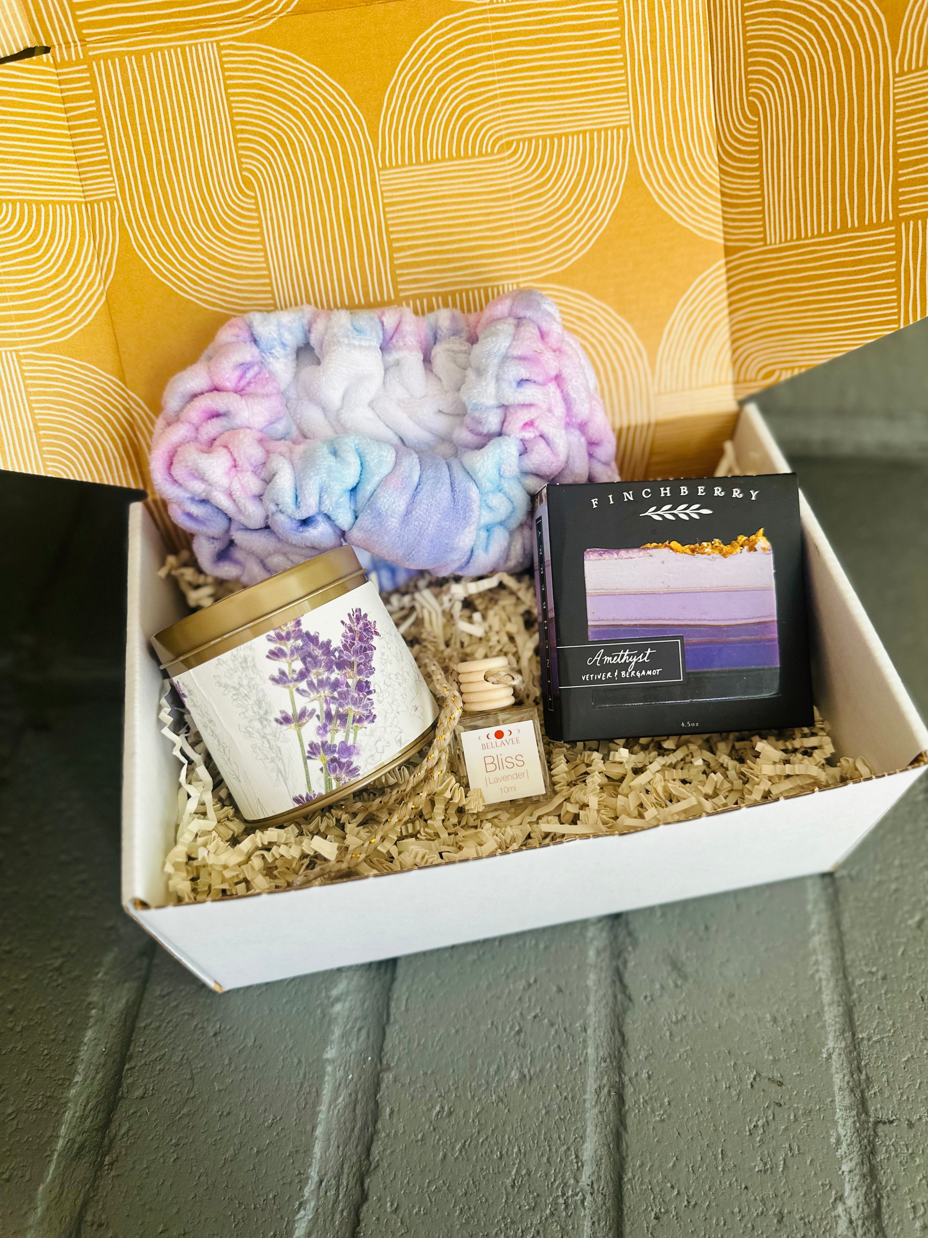 Lavender Bliss Gift Box, featuring a calming lavender car diffuser, luxury Amethyst body soap, and a soothing Roman Lavender candle tin