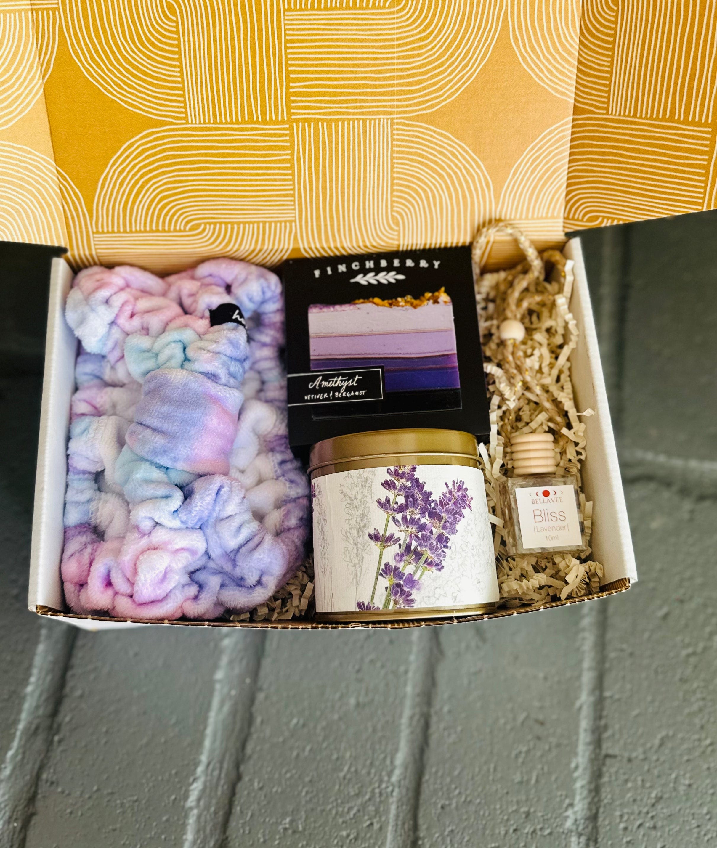 Find peace with the Lavender Bliss Gift Box, featuring lavender-scented products and a spa headband for ultimate relaxation