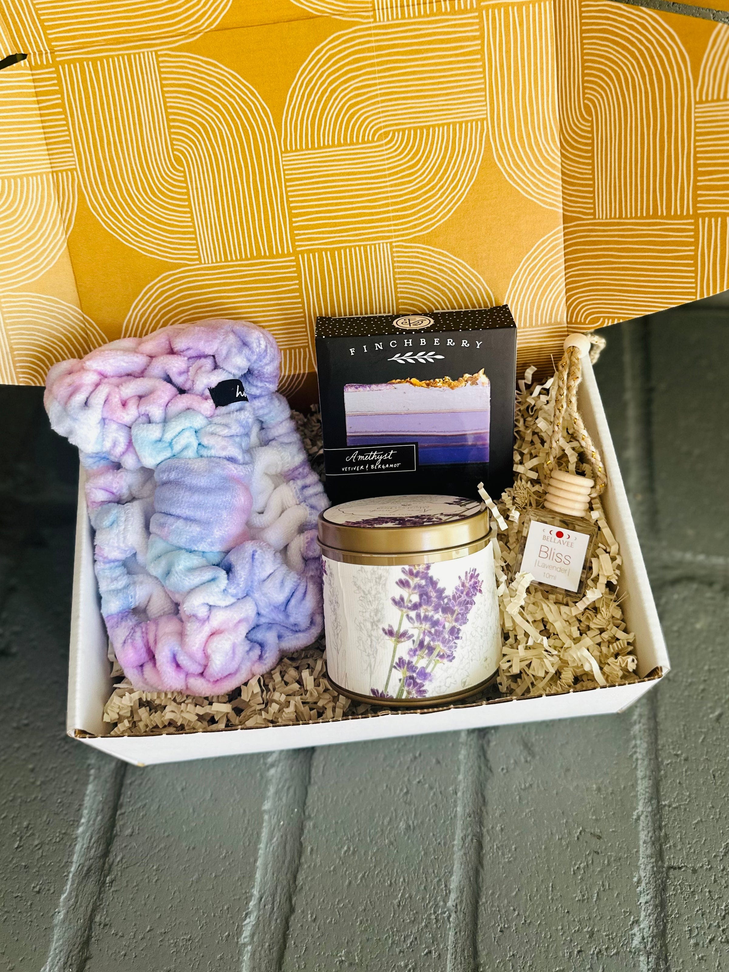 Lavender Bliss Gift Box includes diffuser, soap, candle, and spa headband, packaged beautifully for a soothing self-care experience