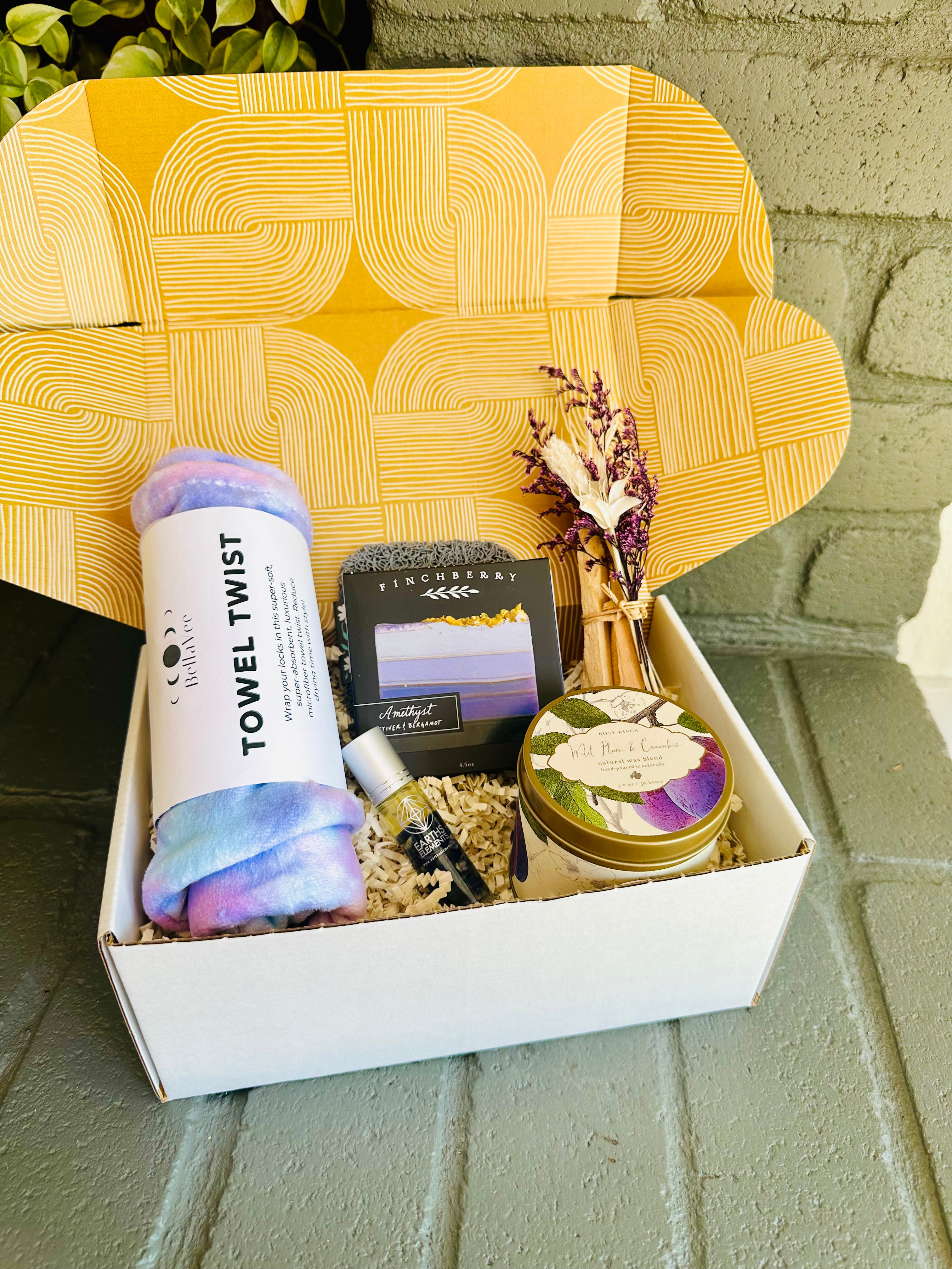 Purple Bliss Gift Box with a calming towel twist, Amethyst soap, and soothing Palo Santo bundle, perfect for self-care and relaxation