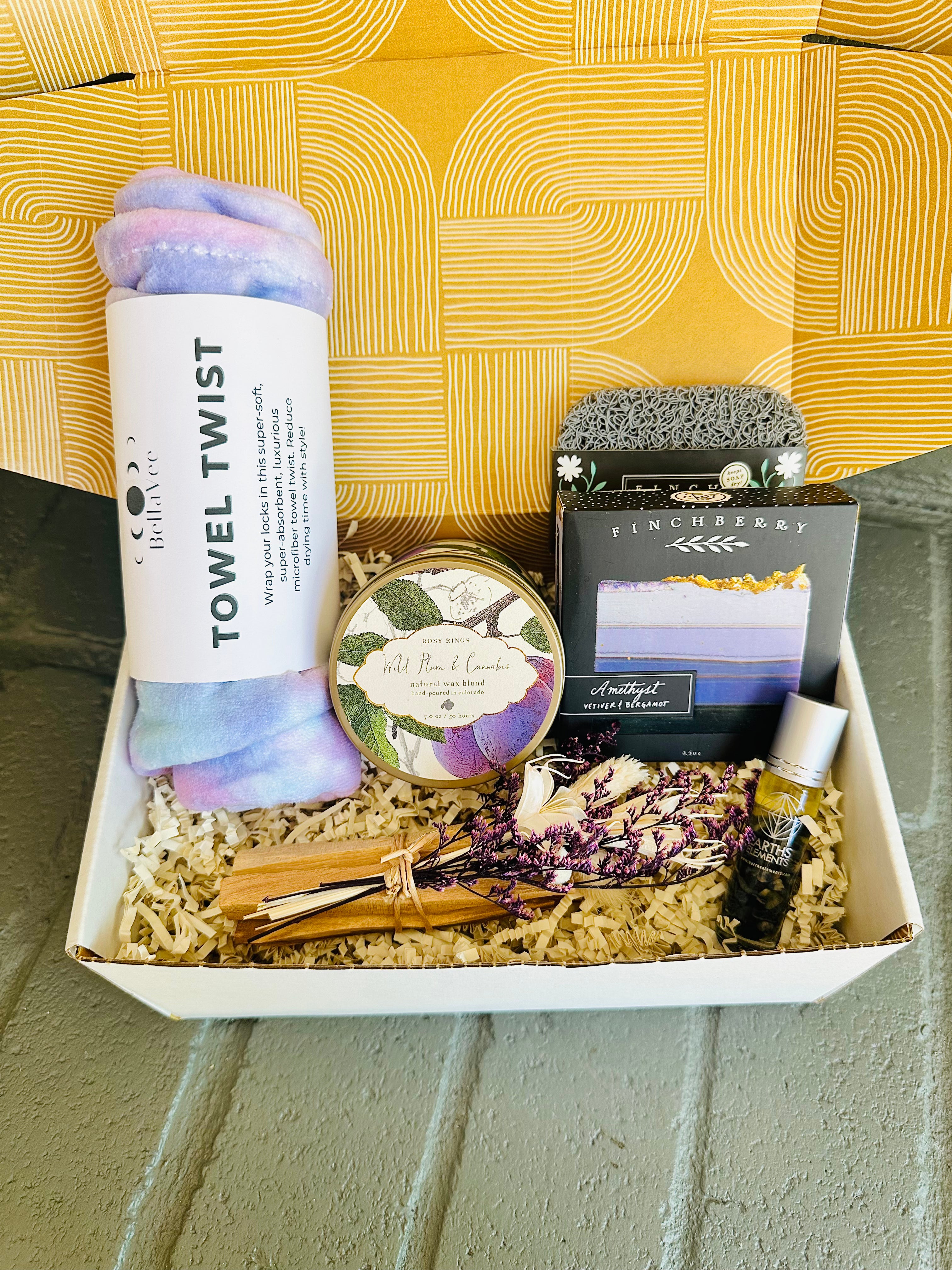 Save more with the Purple Bliss Gift Box, featuring a towel twist, Amethyst soap, Palo Santo bundle, and Wild Plum candle in one set