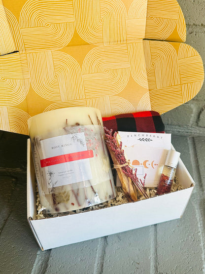 Wrap yourself in serenity with the Winter Warmth Gift Box, featuring a luxurious candle, body soap, and plaid beanie