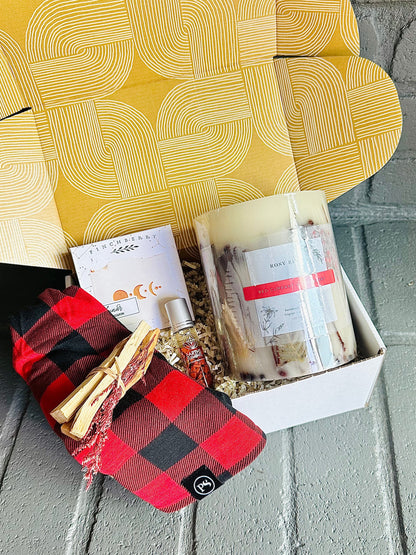 Winter Warmth Gift Box – indulge in holiday comfort with a red currant candle, Palo Santo, essential oil roll-on, and more