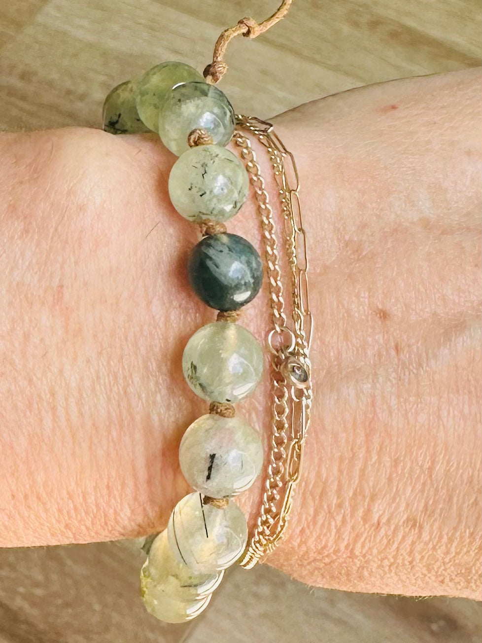 Worn on the wrist, the Moss Agate & Prehnite Mala Bracelet promotes emotional healing and enhances spiritual awareness