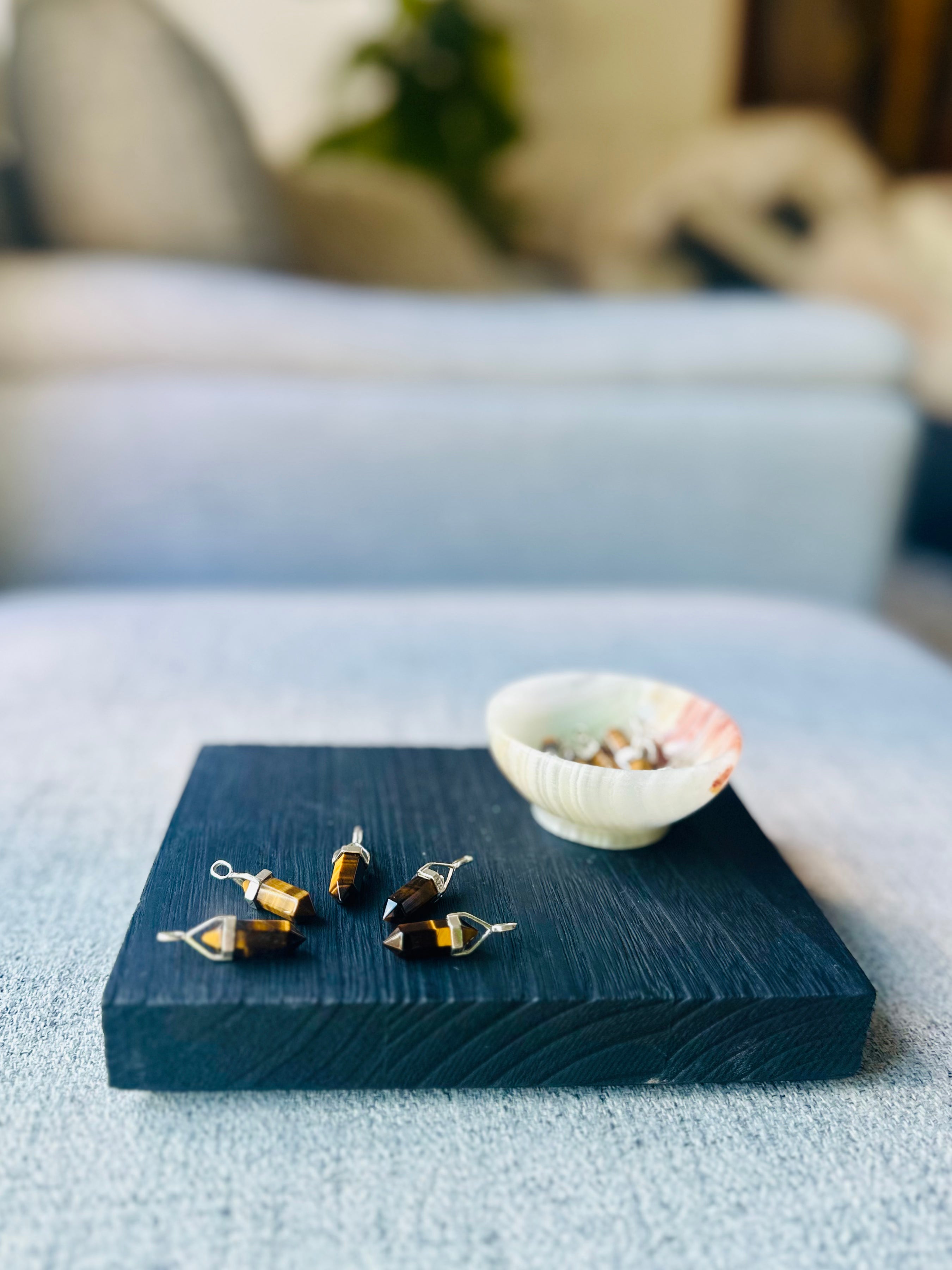 double-terminated tigers eye pendant, sterling silver setting for strength and confidence, featuring golden-brown tigers eye