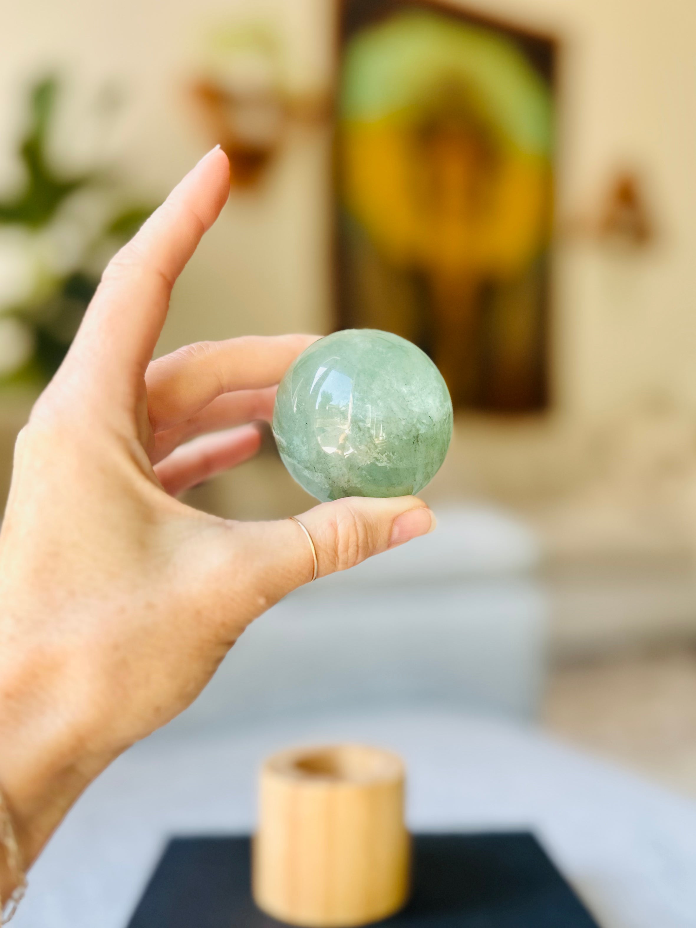 Polished Green Fluorite sphere, known for calming energy and promoting mental clarity, ideal for balancing and enhancing peaceful vibes