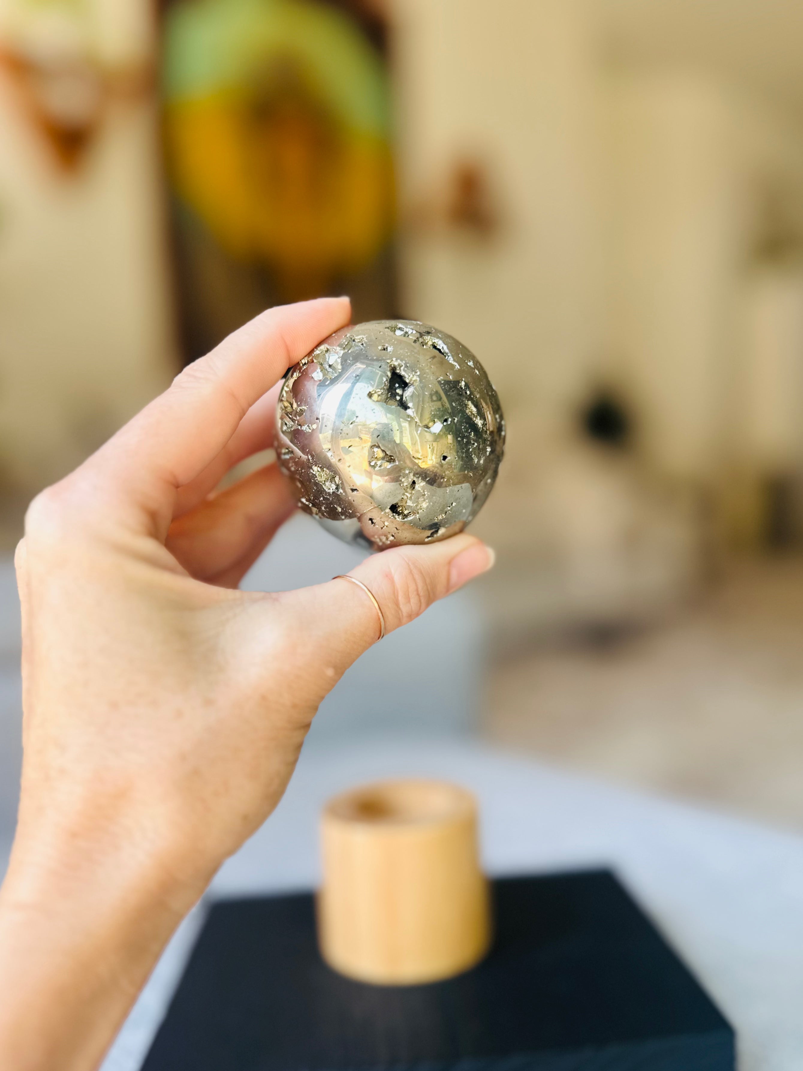 Holding the Pyrite Sphere in hand, feel the powerful energy of wealth and protection radiating from its brilliant metallic luster