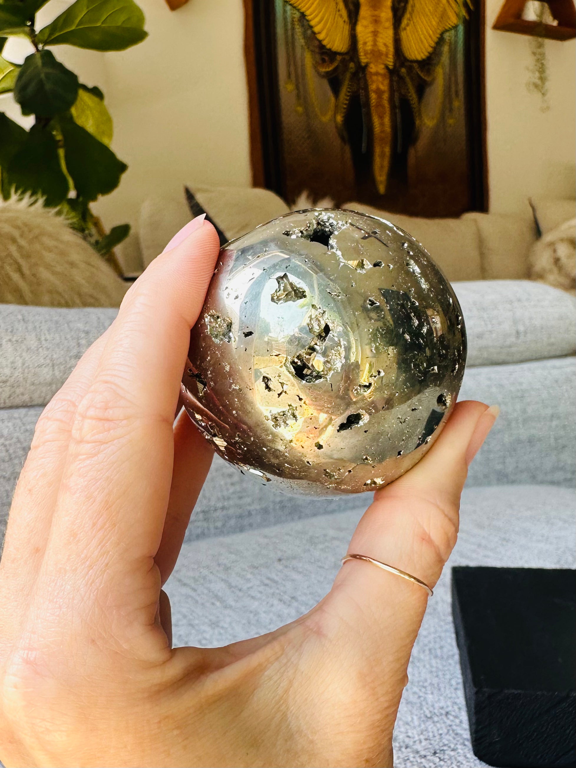 The Pyrite Sphere fits perfectly in your hand, offering a tactile reminder of strength, focus, and prosperity during meditation or energy work