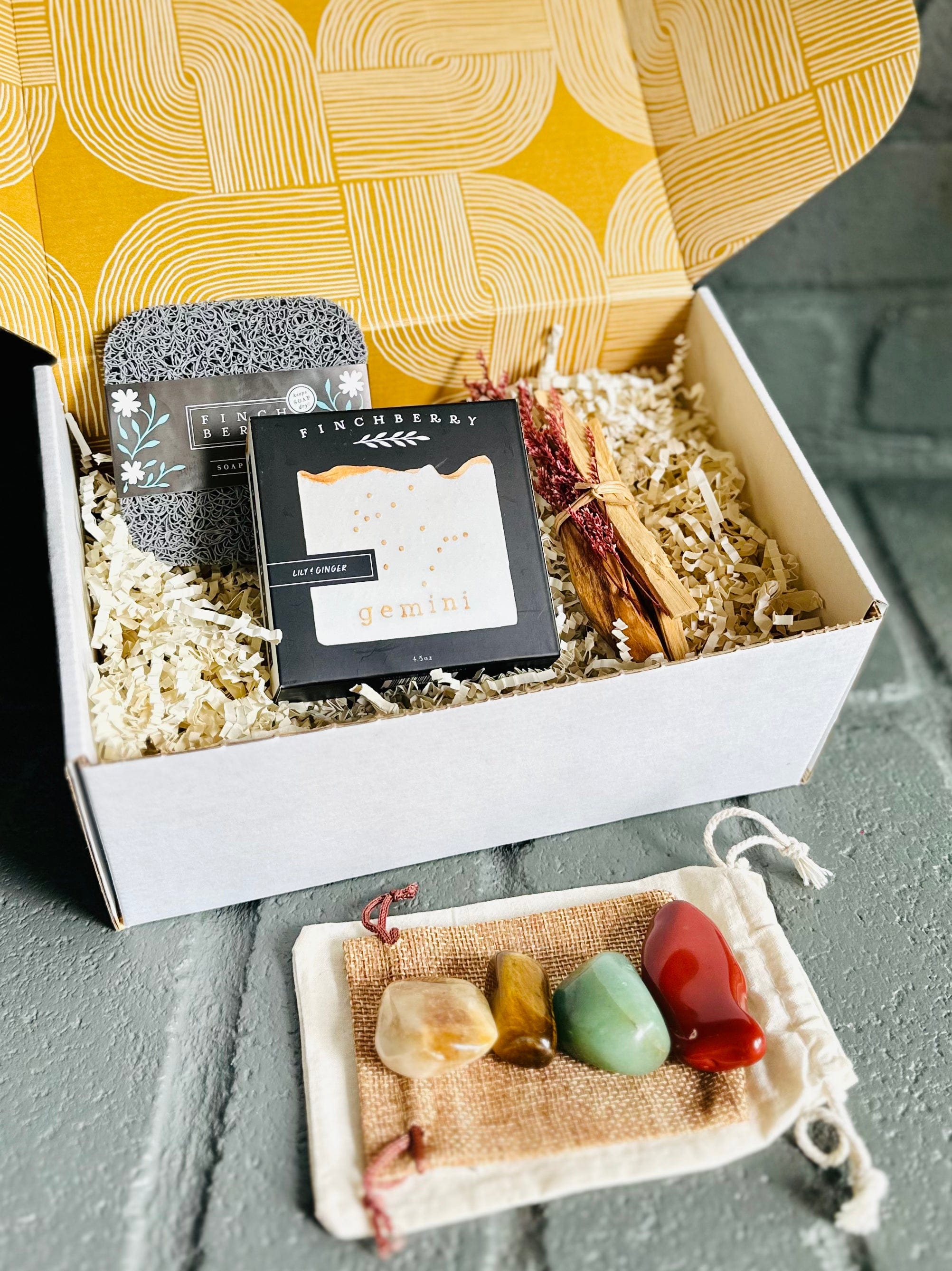 Gemini gift box with handmade soap and soap saver, Palo Santo bundle, and tumbled stones for Gemini and astrology lovers.