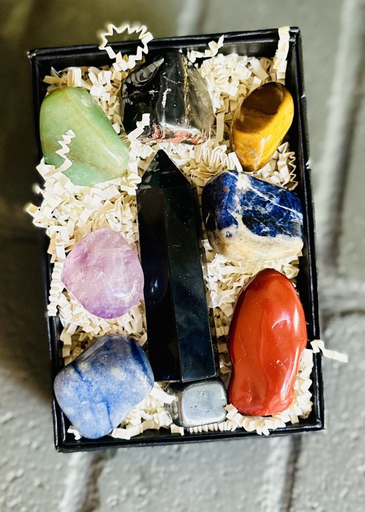 Balanced Energy Crystal Box features vibrant colors, from deep red Jasper to soothing blue Sodalite, promoting balance and growth