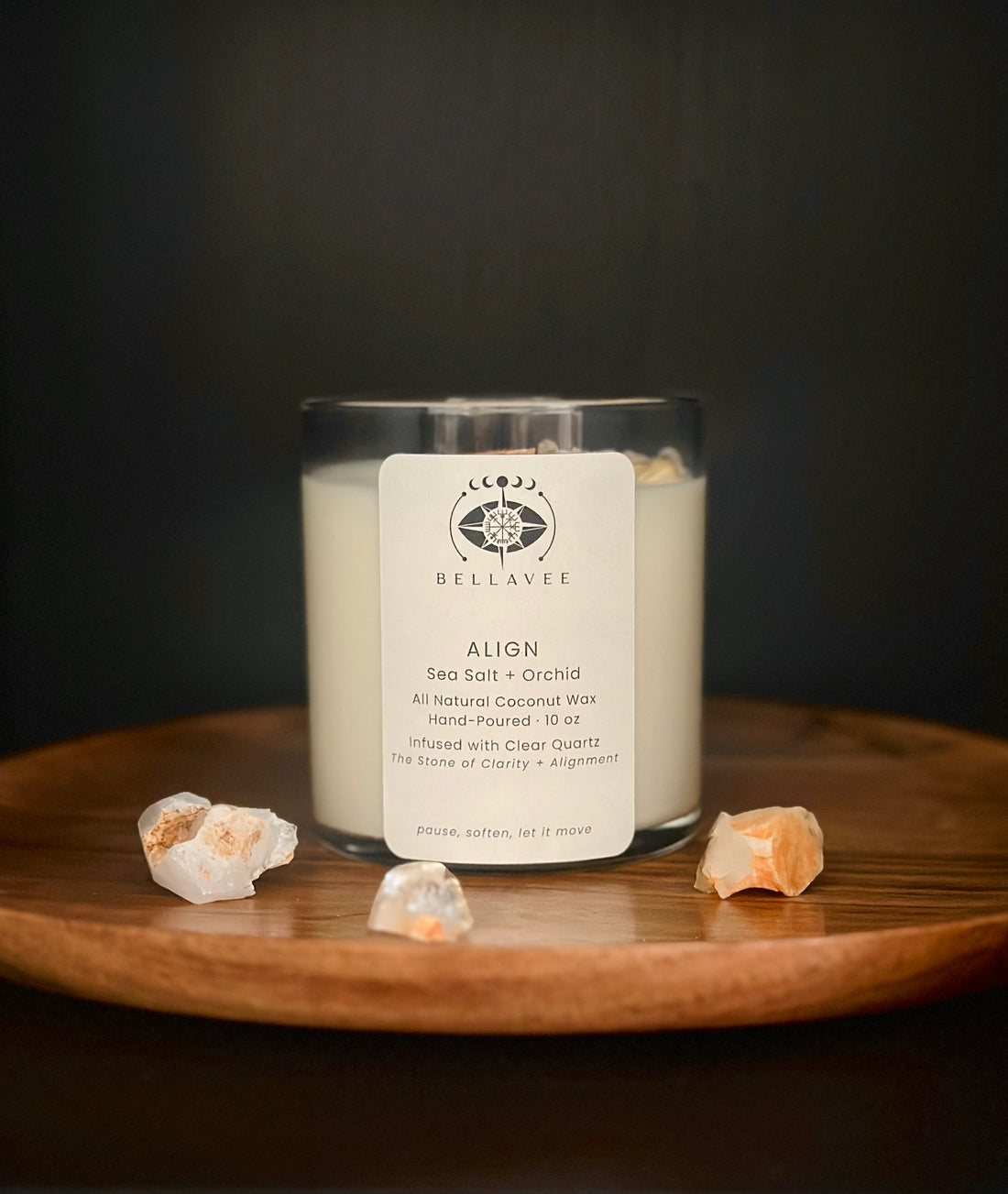 Align Clear Quartz crystal ritual candle in a glass vessel on a wooden surface.