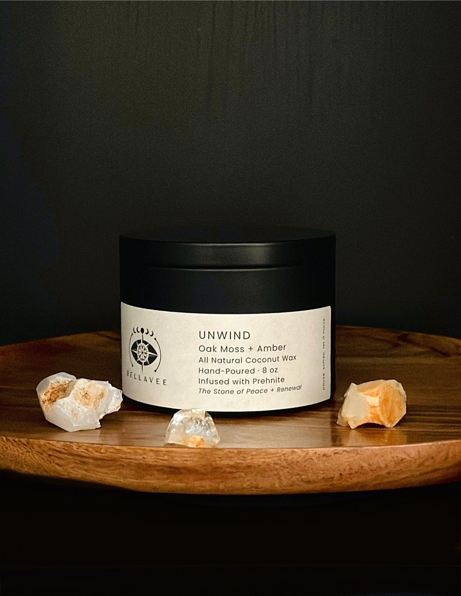 Unwind Prehnite crystal ritual candle tin styled on a wooden surface.