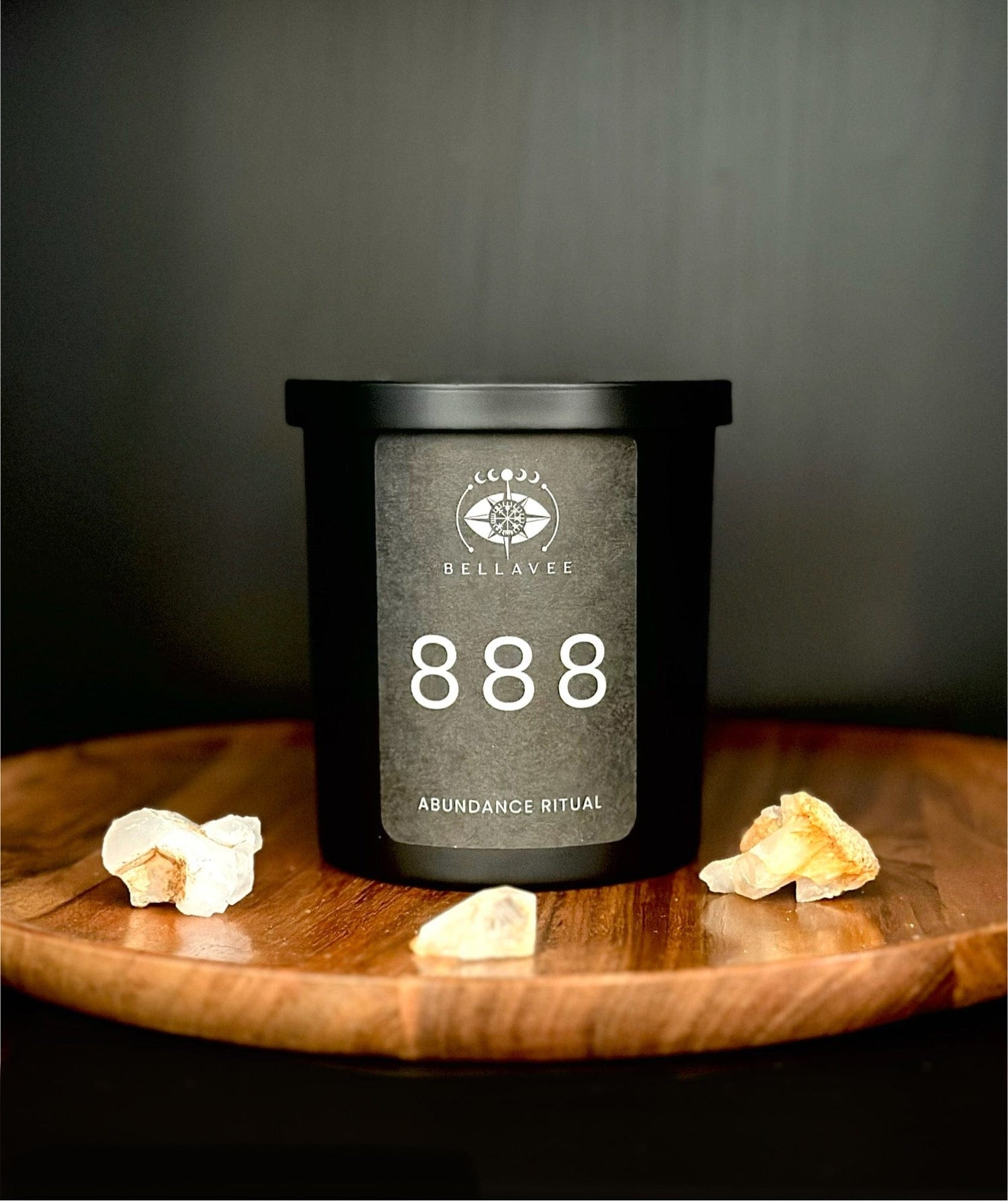 Citrine abundance ritual candle in matte black with a warm scent blend designed to support prosperity, confidence, and manifestation.