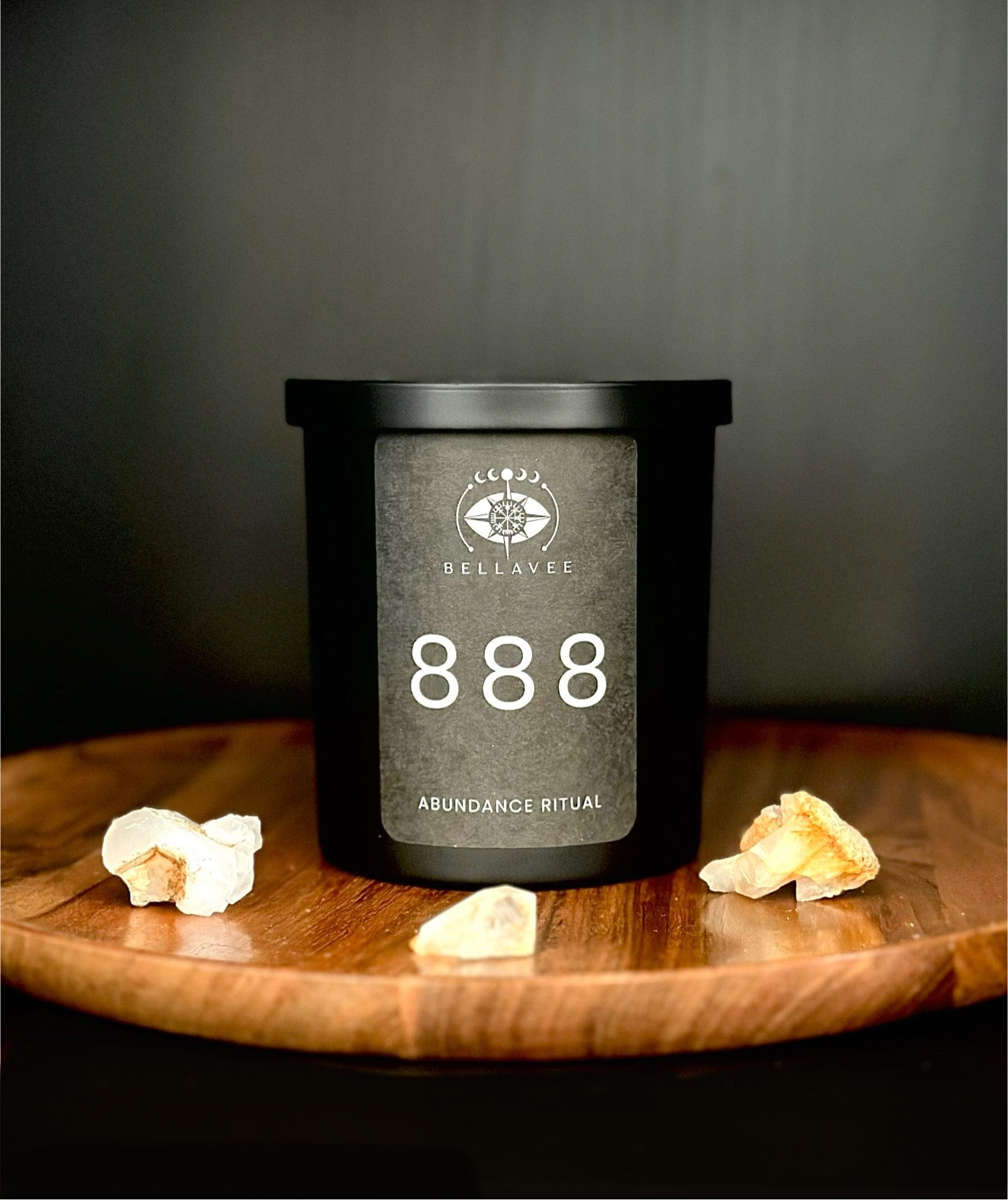 Citrine abundance ritual candle in matte black with a warm scent blend designed to support prosperity, confidence, and manifestation.