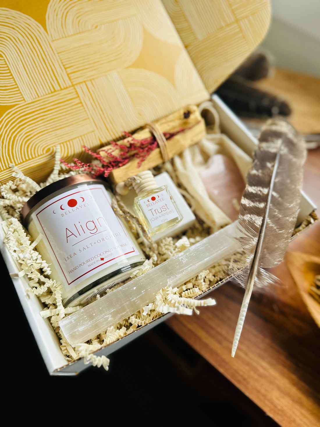 Align our best seller crystal candle in a thoughtful gift box with our mini car diffuser, Palo Santo bundle, beautiful feather and a gua sha tool in rose quartz