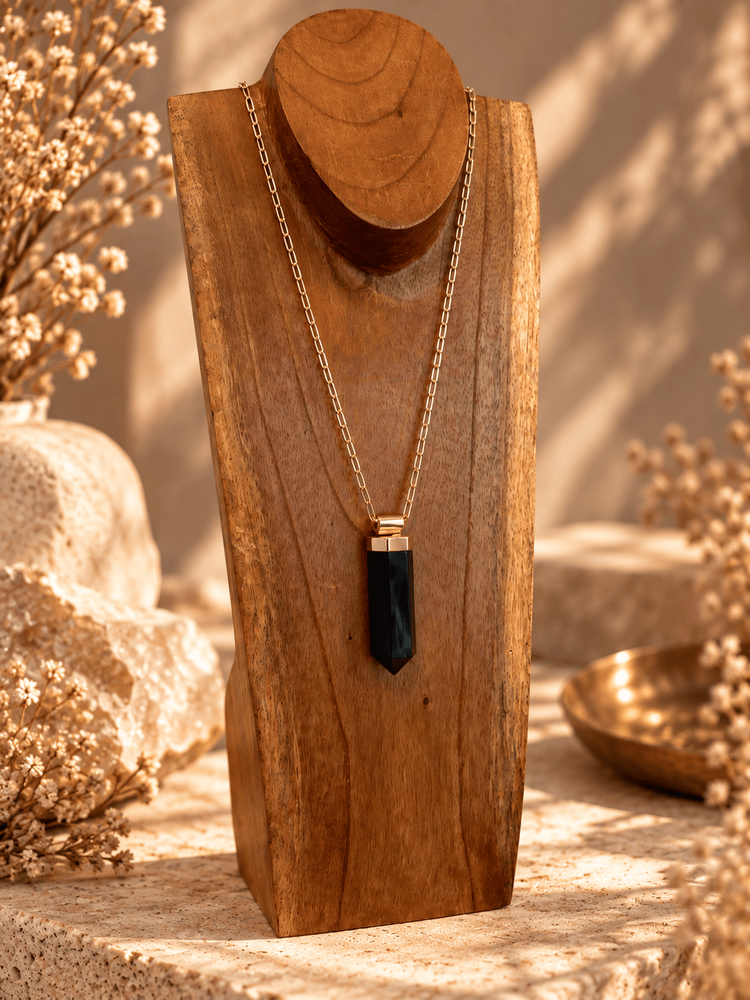 Large Amethyst crystal pendant necklace on adjustable gold open-link chain displayed on wooden jewelry stand