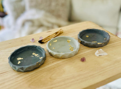 Flat lay of multiple cement dishes showing color variations